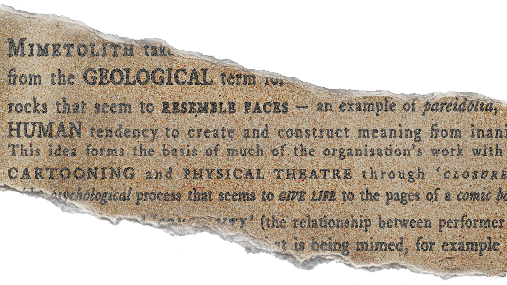 A torn piece of paper with printed text discussing MIMETOLITH, a geological term, and its connection to face resemblance and organizational concepts.