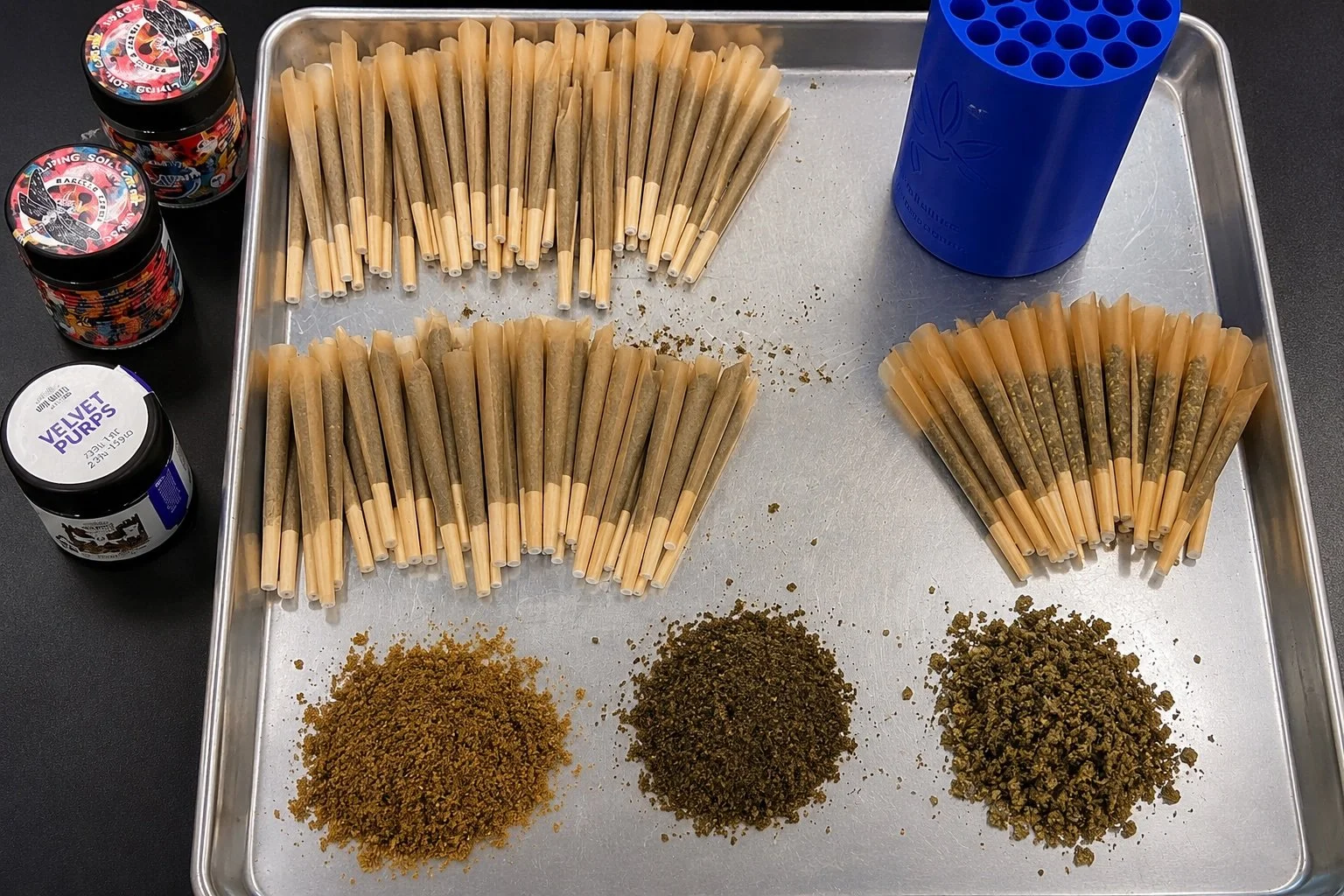 Prerolls with different cannabis flower grind sizes used for preroll manufacturing and cone filling