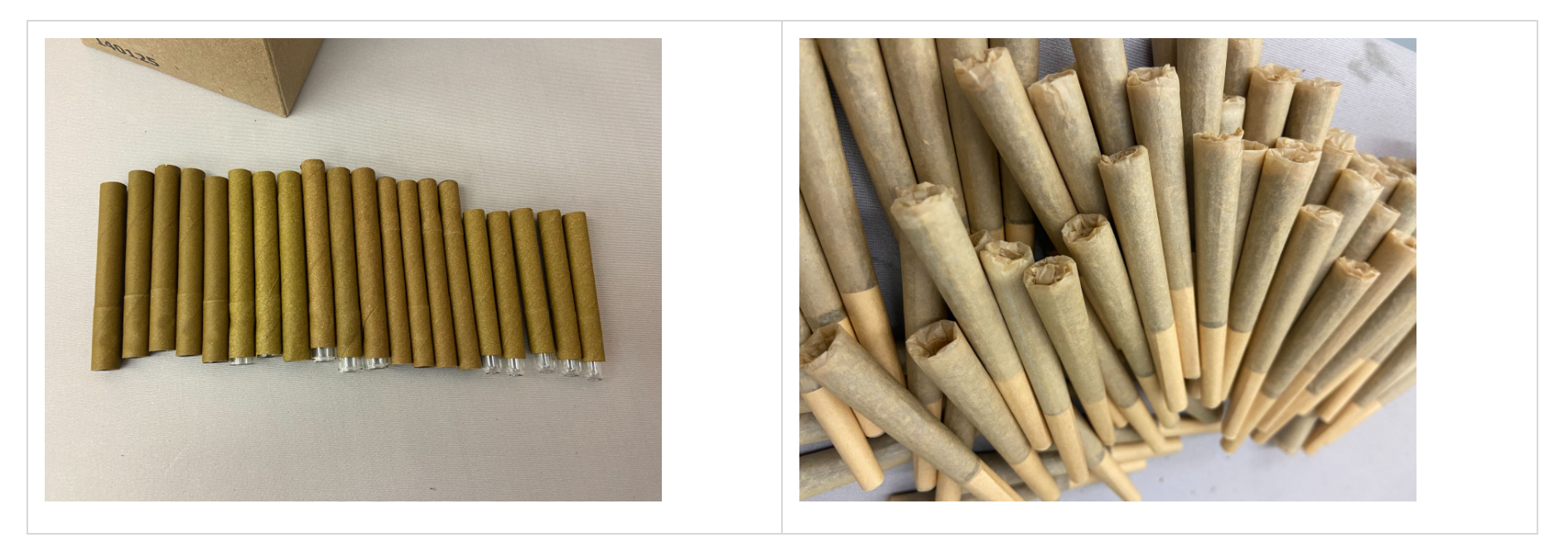 Glass-tip tubes lined up beside a cluster of paper prerolls in different sizes.