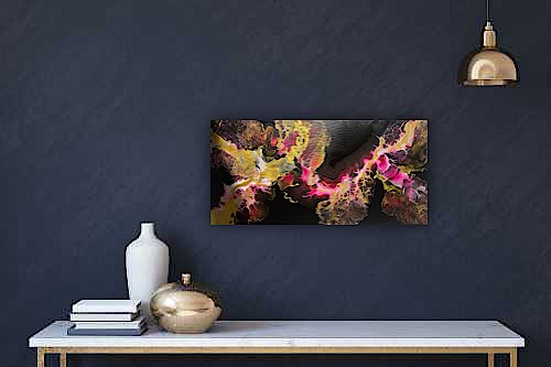 Decorative wall with abstract artwork, white vase, silver bowl, books, modern gold ceiling lamp on navy wall