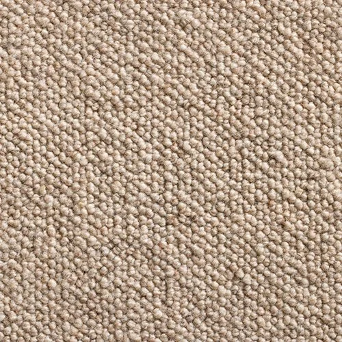 Close-up image of a beige, textured carpet with tightly packed loops.
