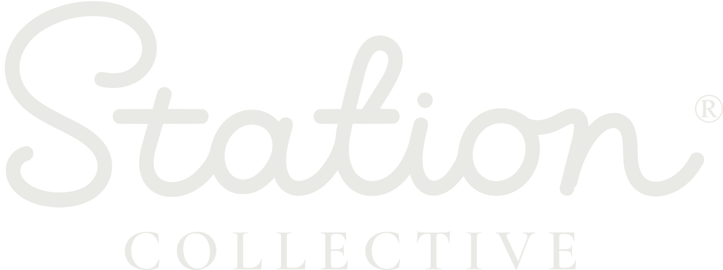 Station Collective logo in white cursive and uppercase text on black background