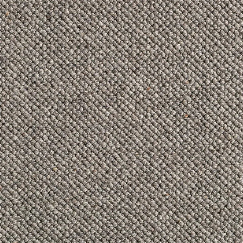 Close-up of textured grey carpet with woven pattern.