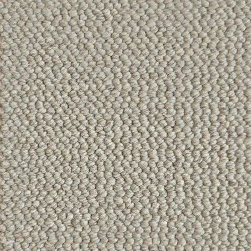 Close-up of beige textured carpet with looped fibers