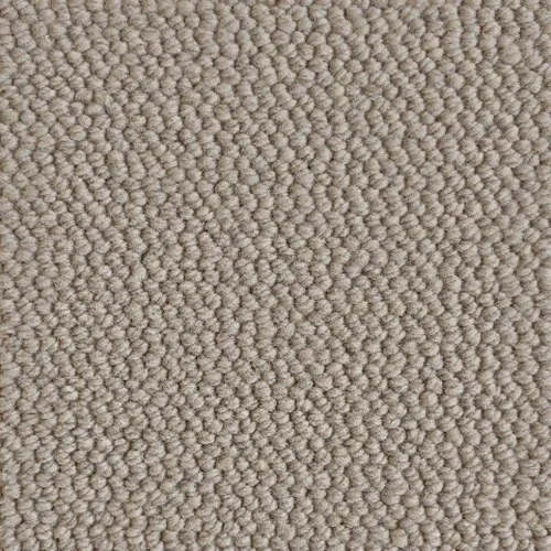 Close-up image of beige textured carpet with tightly woven loops.