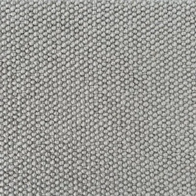 Close-up of a textured gray fabric surface with a small, intricate pattern.