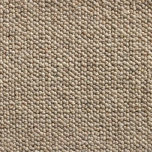 Close-up of beige textured carpet with small loop fibers.