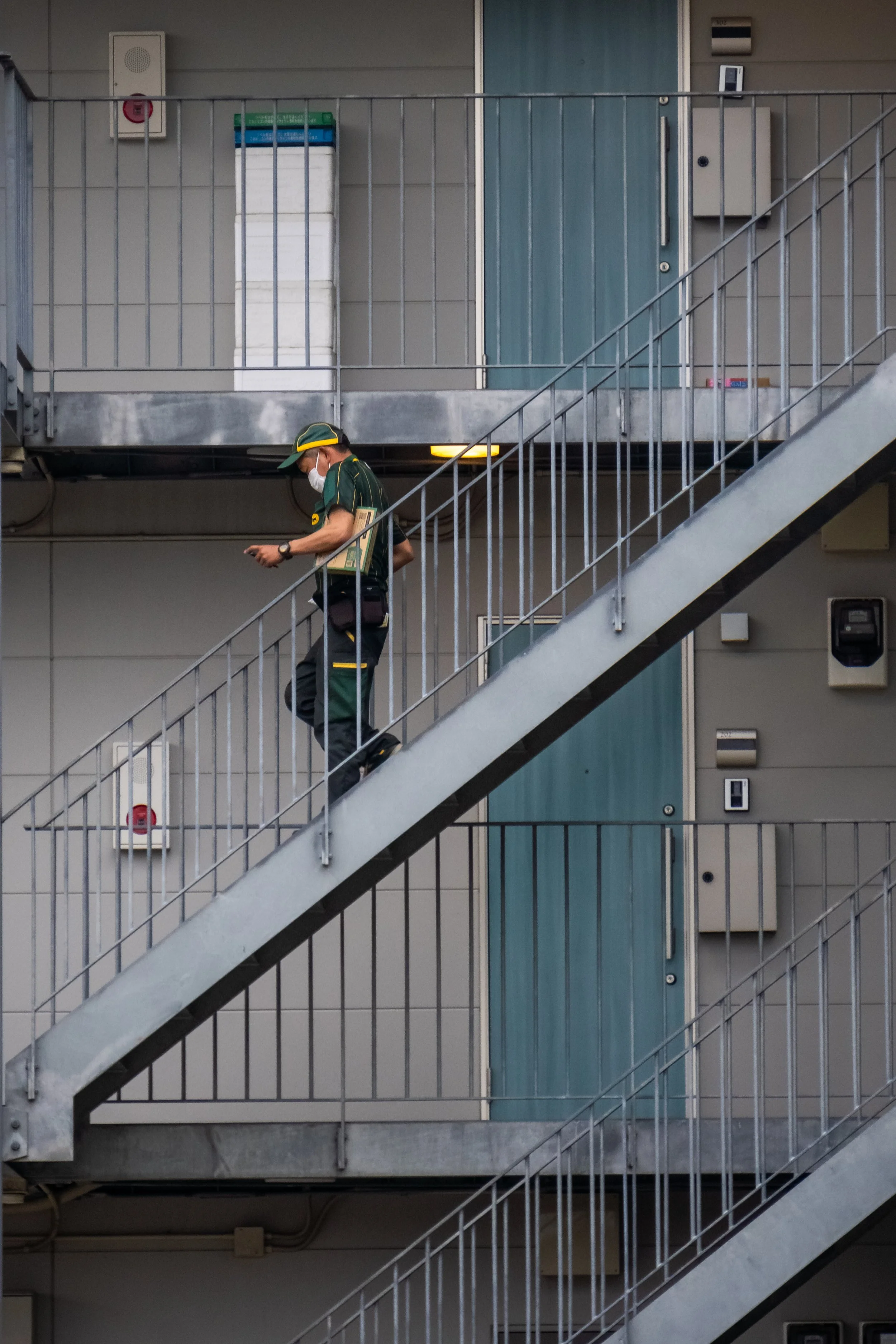 postman coming down the stairs.jpg