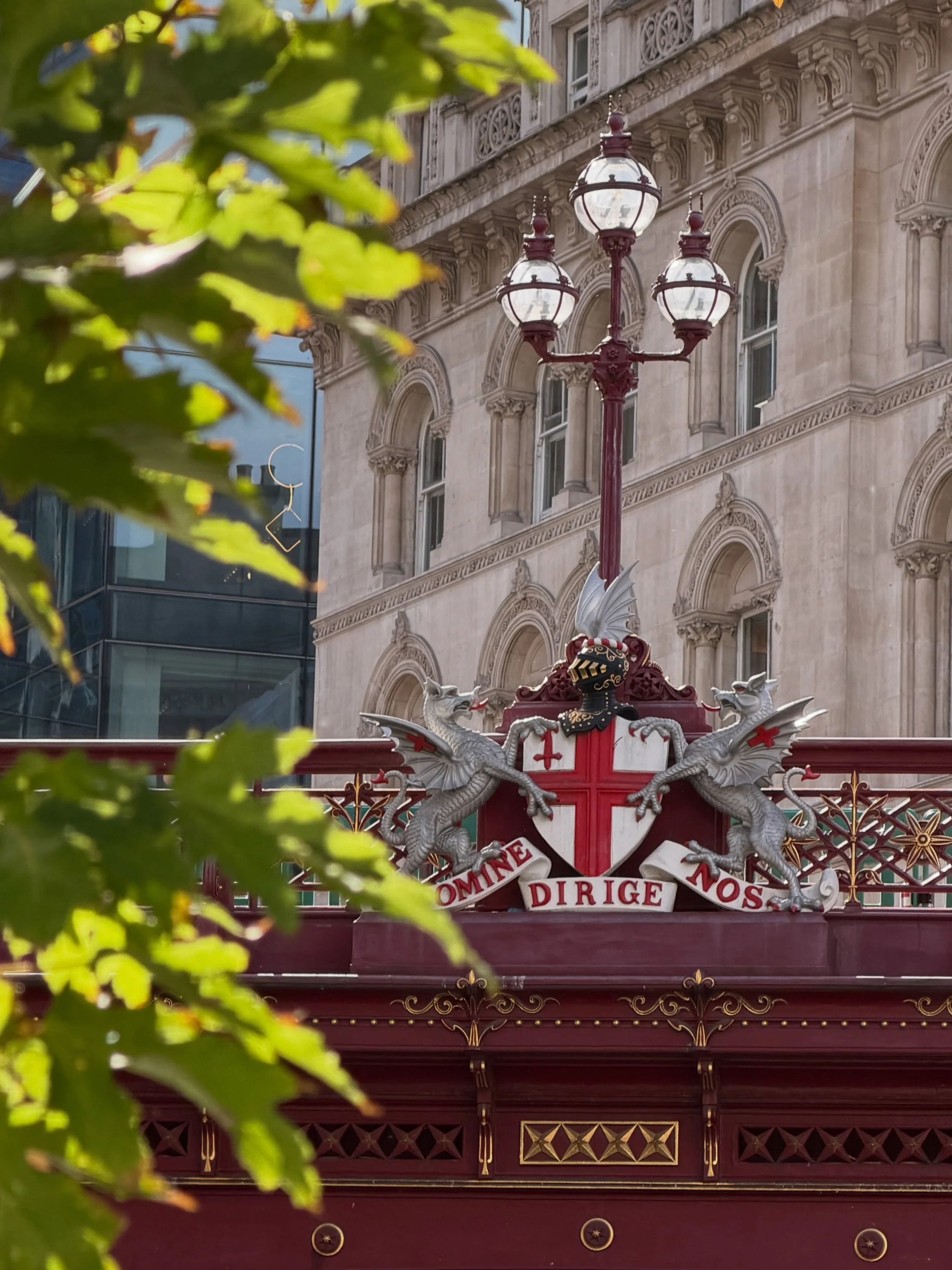DOMINE DIRIGE NOS means Lord Guide Us and is the official motto of the City of London Corporation (the historic financial district and &ldquo;Square Mile&rdquo;), used since the early 17th century (recorded as early as 1633).

You can find this Latin
