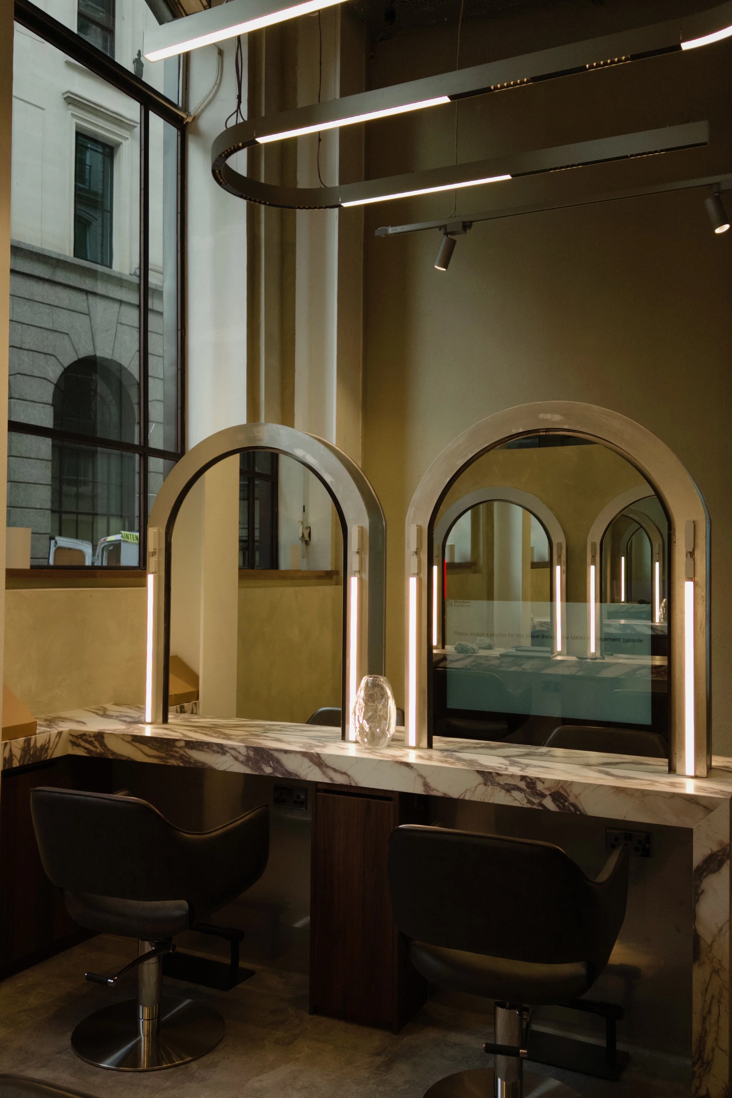 Interactive in-mirror screen at SCL Liverpool Street hair salon styling station, EC2N