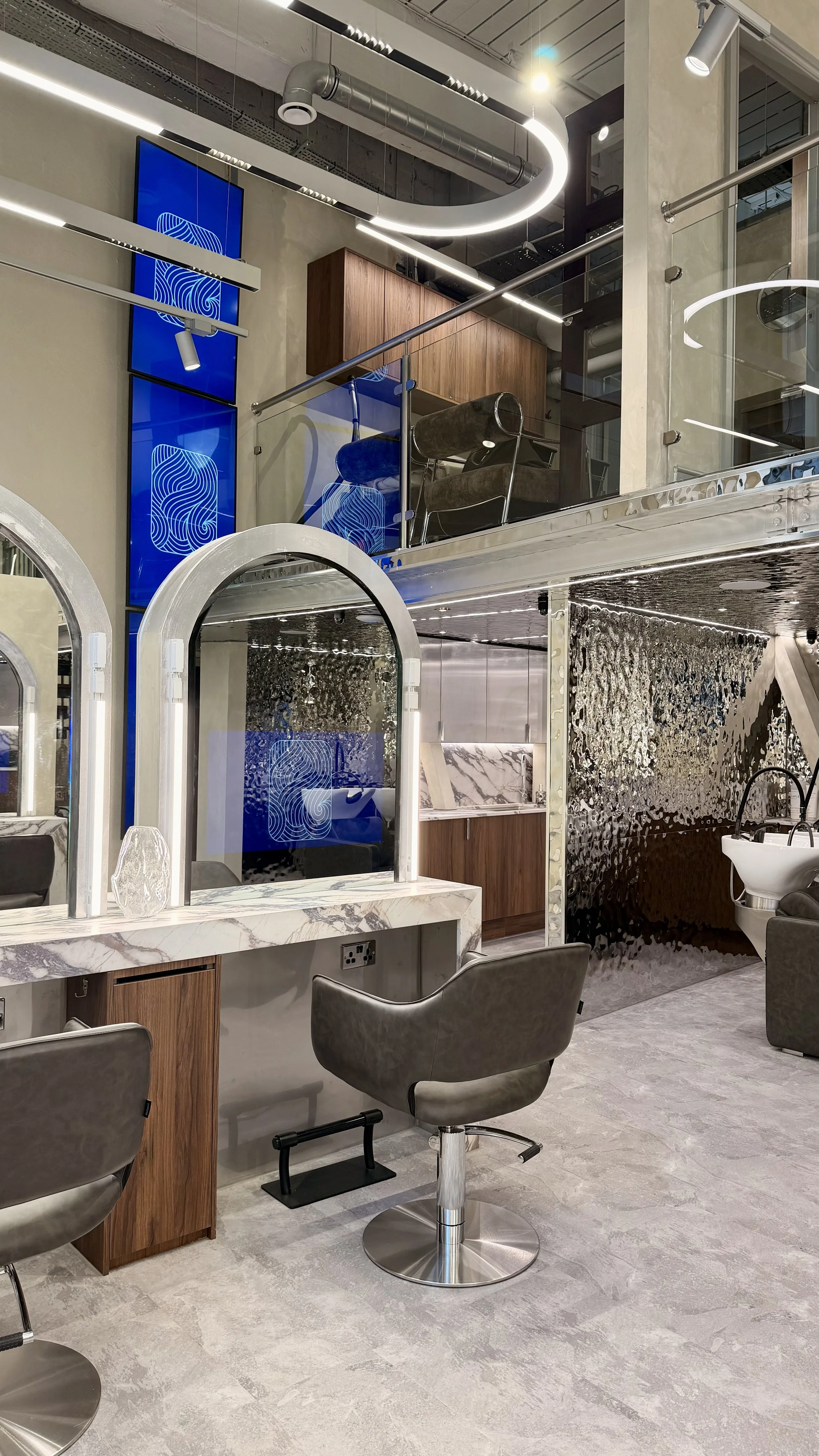 Interactive in-mirror screen at SCL Liverpool Street hair salon styling station, EC2N