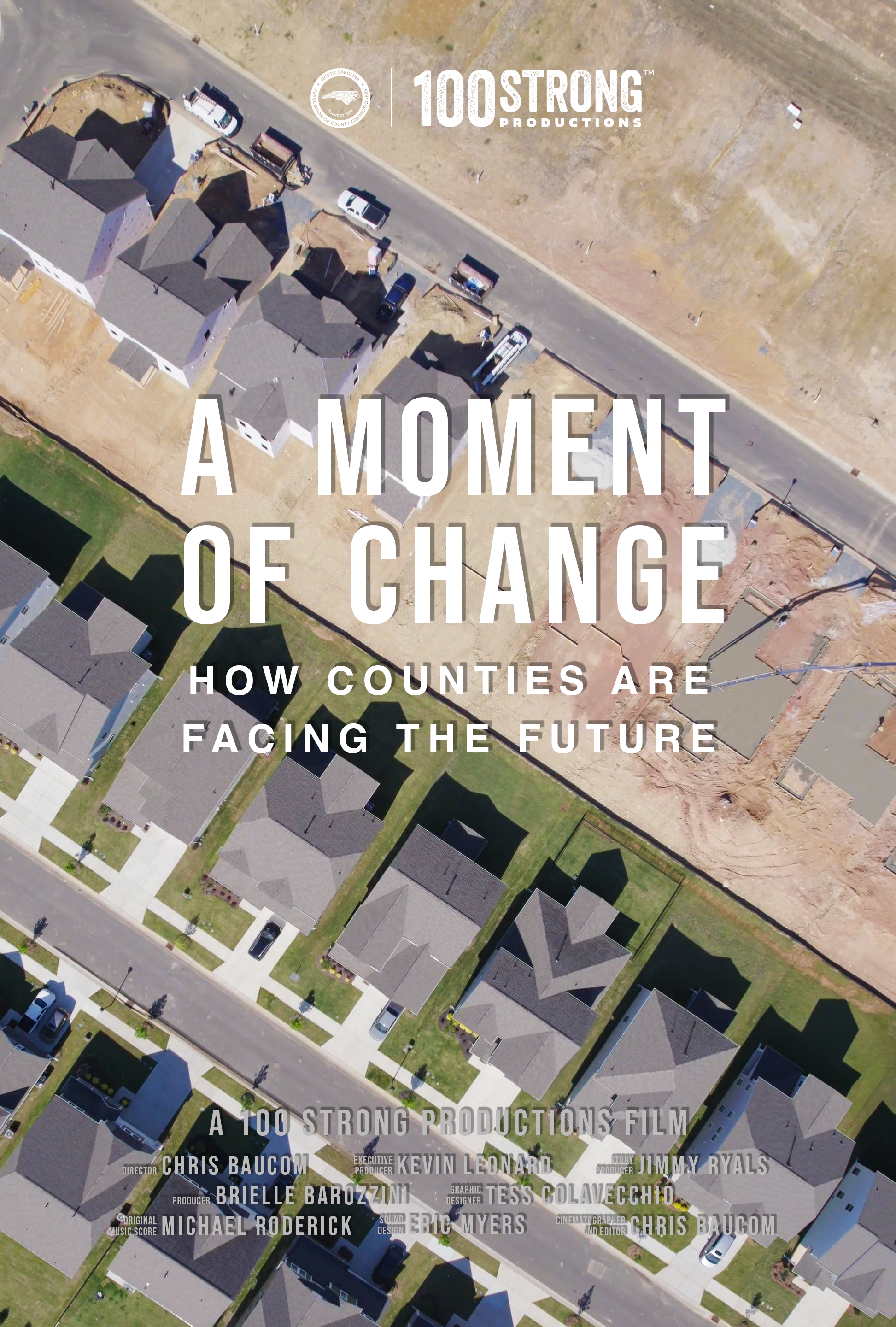 Aerial view of a suburban neighborhood with houses, a street, and an empty lot with excavation equipment, overlaid with text for a film titled 'A Moment of Change'.