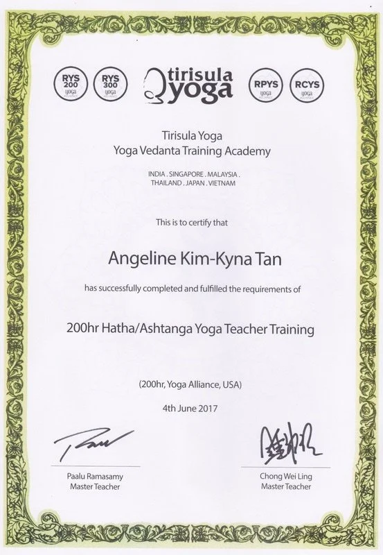 Certificate of completion for Angeline Kim-Kyna Tan in Hatha/Ashtanga Yoga Teacher Training from Tirisula Yoga, awarded on June 4, 2017, signed by two master teachers, with decorative green border and logos of Tirisula Yoga.