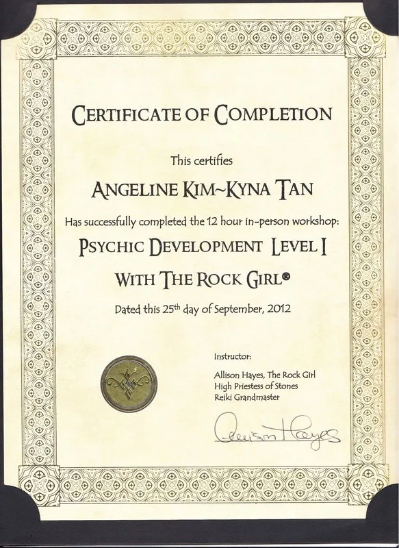 Certificate of completion awarded to Angeline Kim-Kyna Tan for completing a 12-hour in-person workshop titled "Psychic Development Level 1 with The Rock Girl" on September 25, 2012. The certificate includes signatures and a seal and lists the instruc