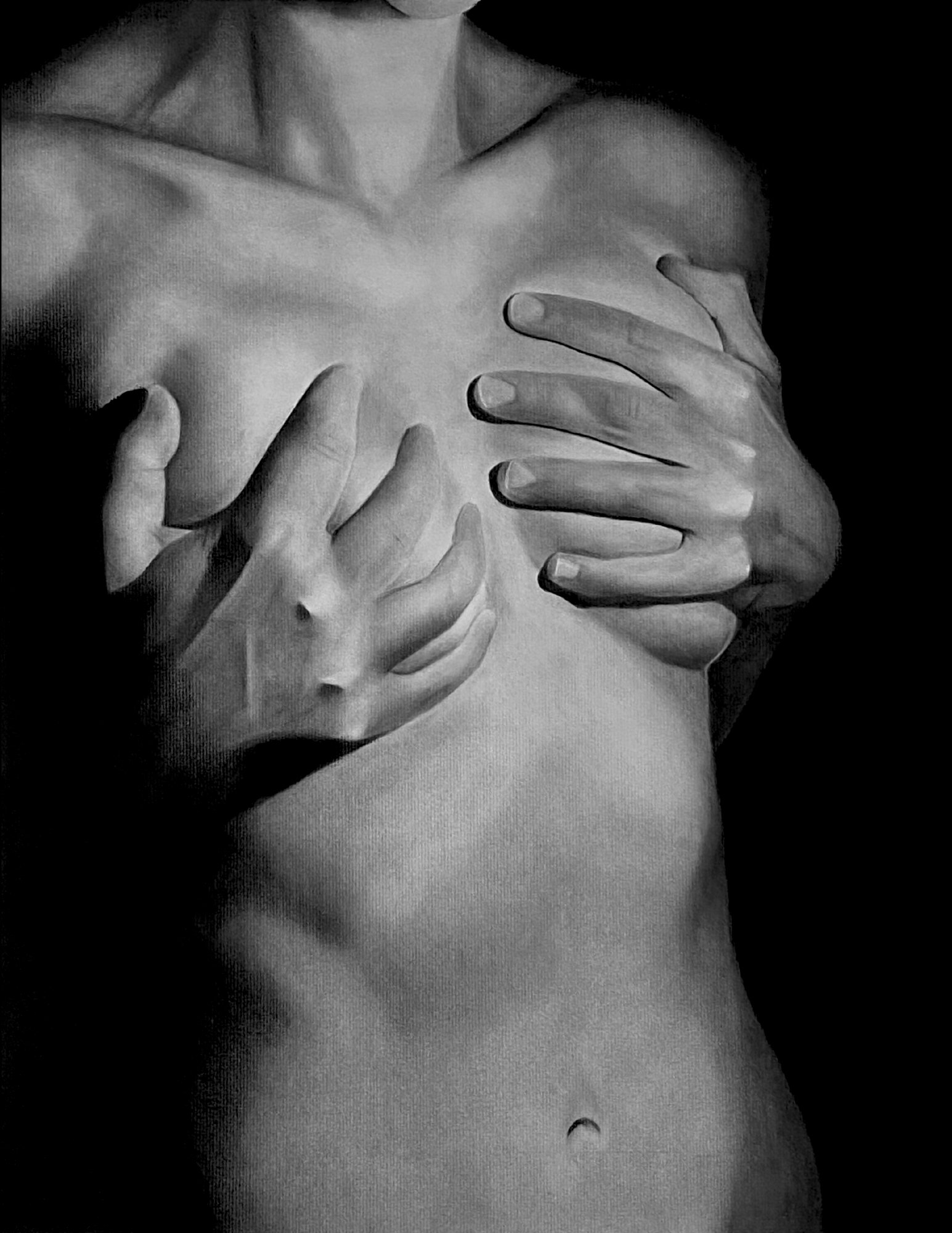 Black and white photograph of a woman's upper torso with hands gently touching her chest and abdomen, cropped at the neck and lower waist.