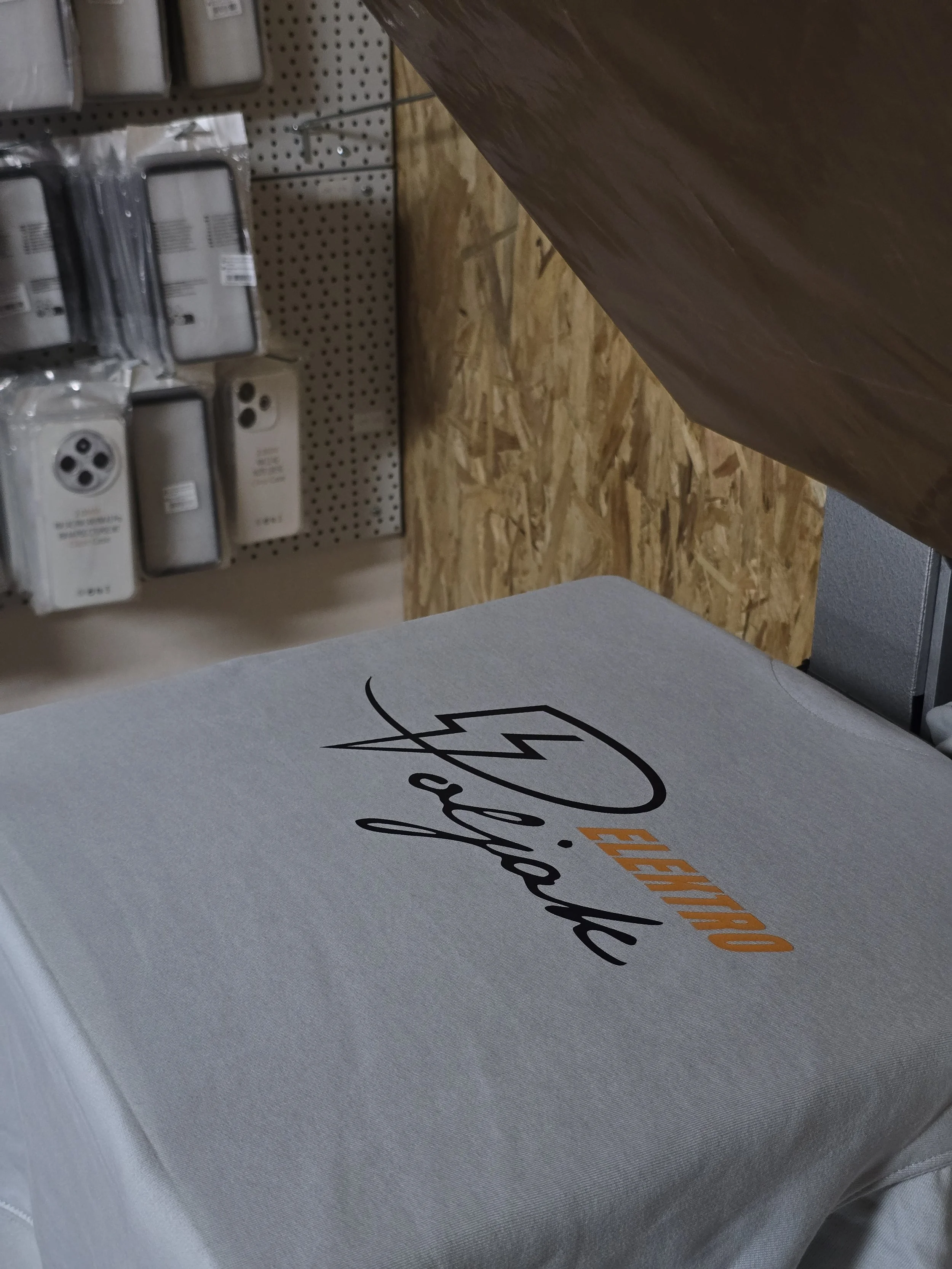 Close-up of a table with a cardboard box labeled 'This Side Up' and other store display items in the background.
