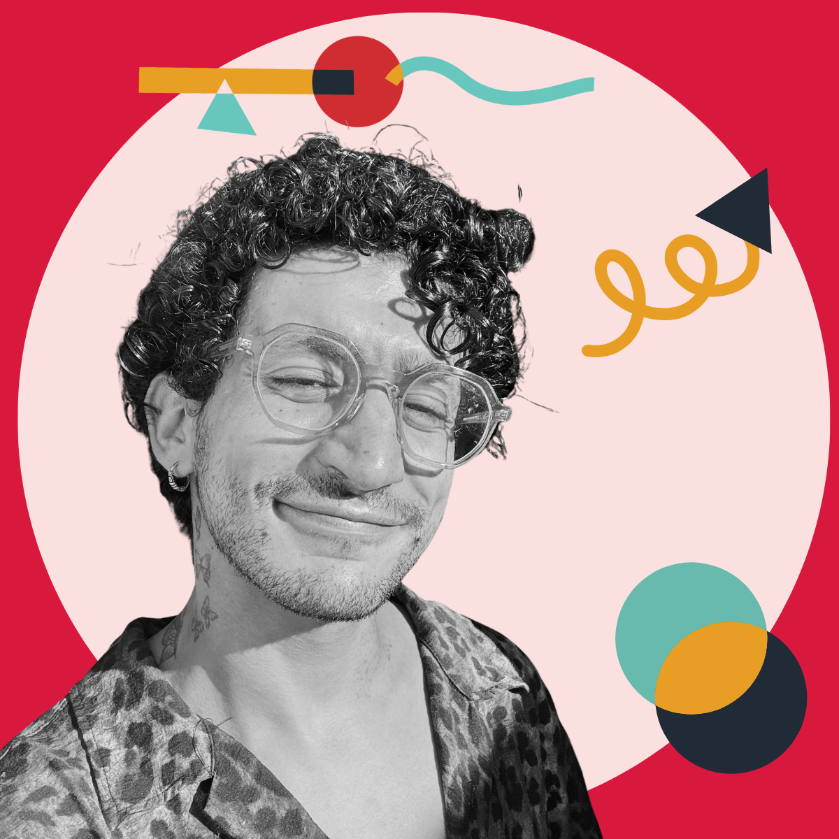 A black and white photo of a person with curly hair, clear glasses, and a tattoo on their neck, smiling with eyes closed, set against a colorful abstract background.