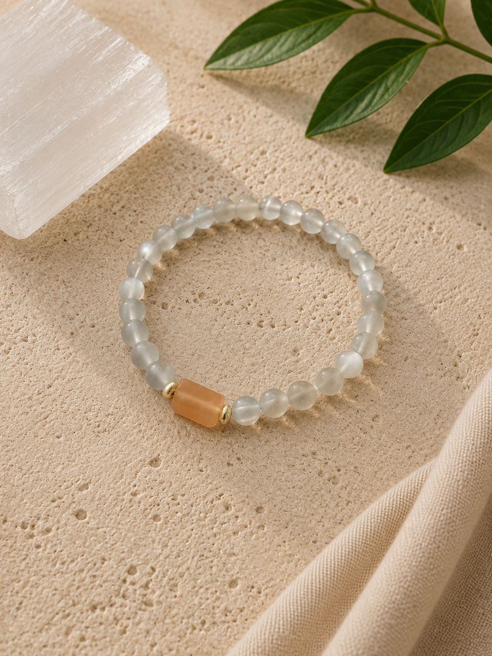 Created for a woman who realized she had become so focused on taking care of what needed to be done that she rarely made room for what simply made her happy.

Bicolor sunstone was chosen as a reminder of joy, optimism, and confidence, while peach moo