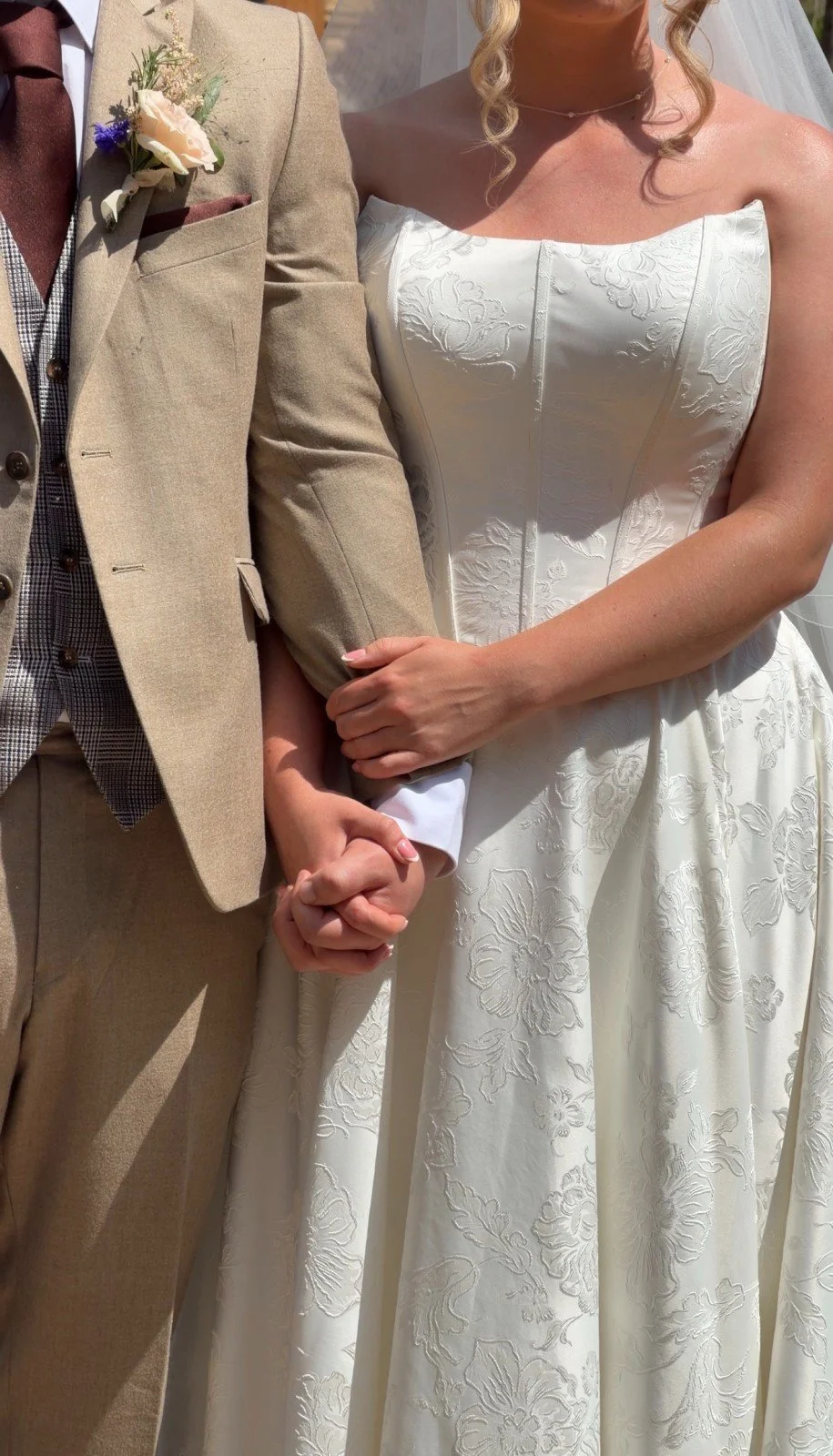 Married couple holding hands