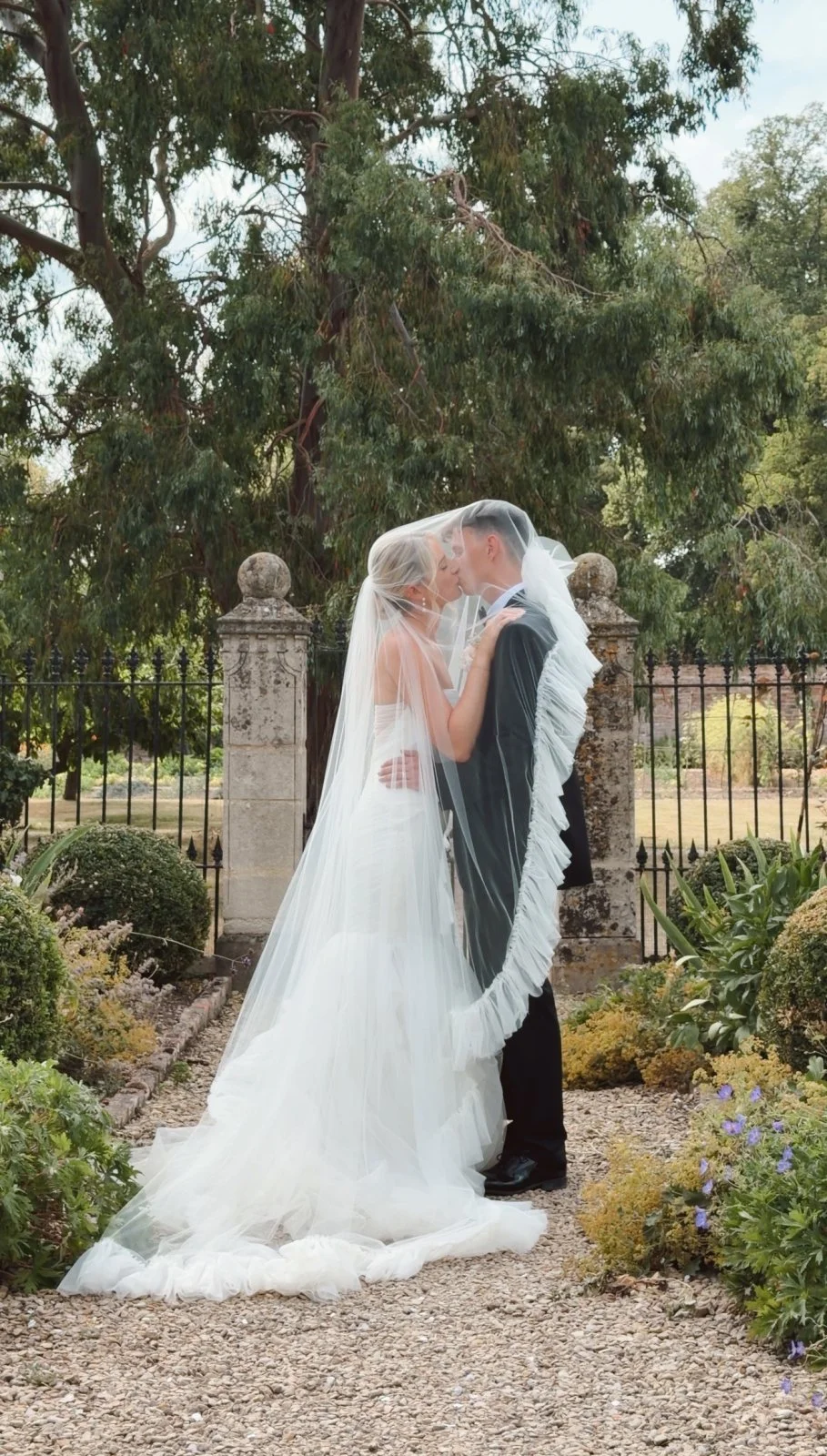A married couple kissing