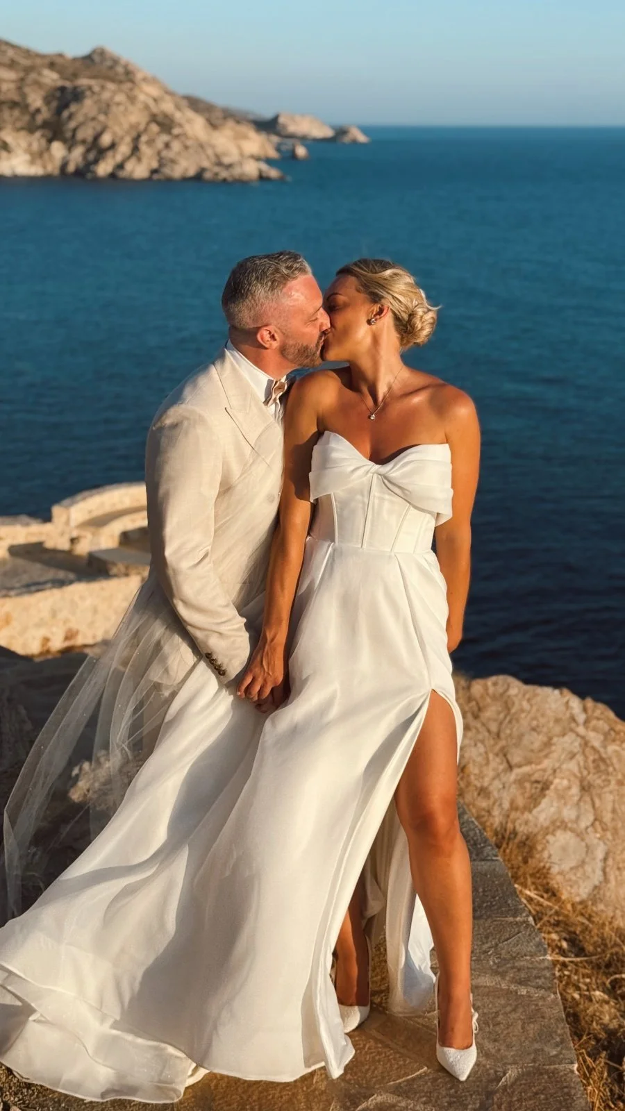 Married couple at destination wedding kissing