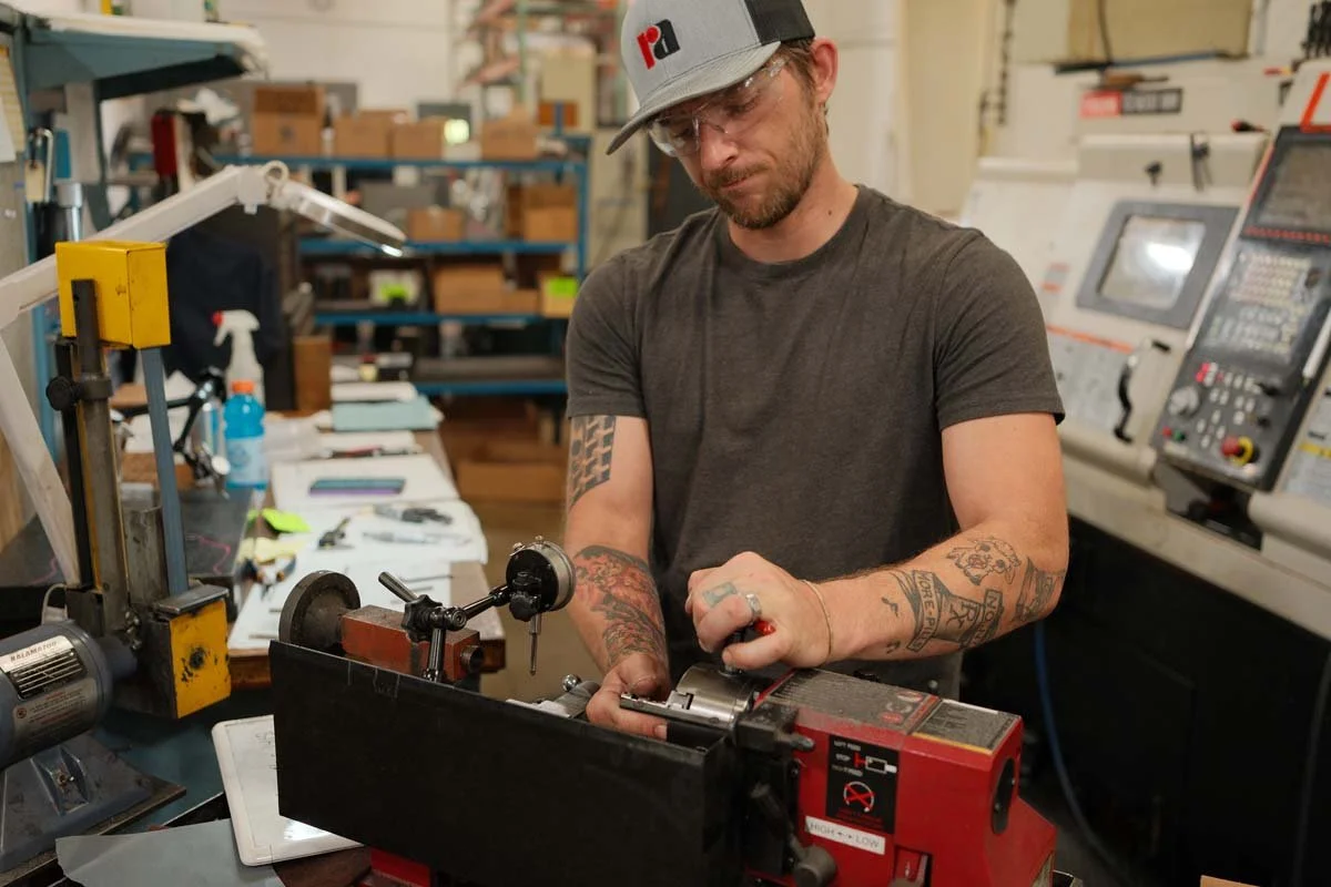 Machinist working at Clark Manufacturing's Northern Michigan CNC machine shop