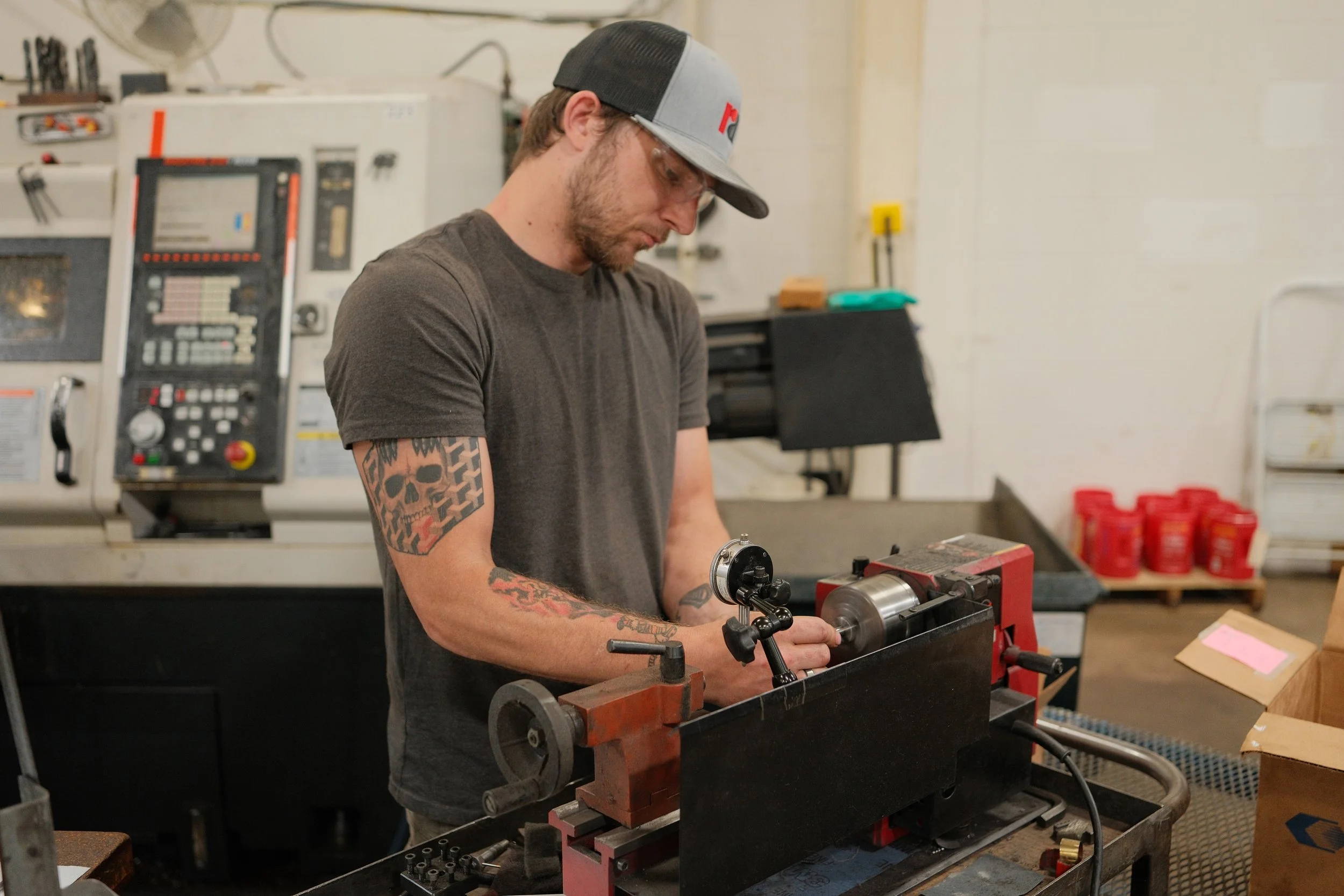 Clark Manufacturing machinist working on a precision-machined component