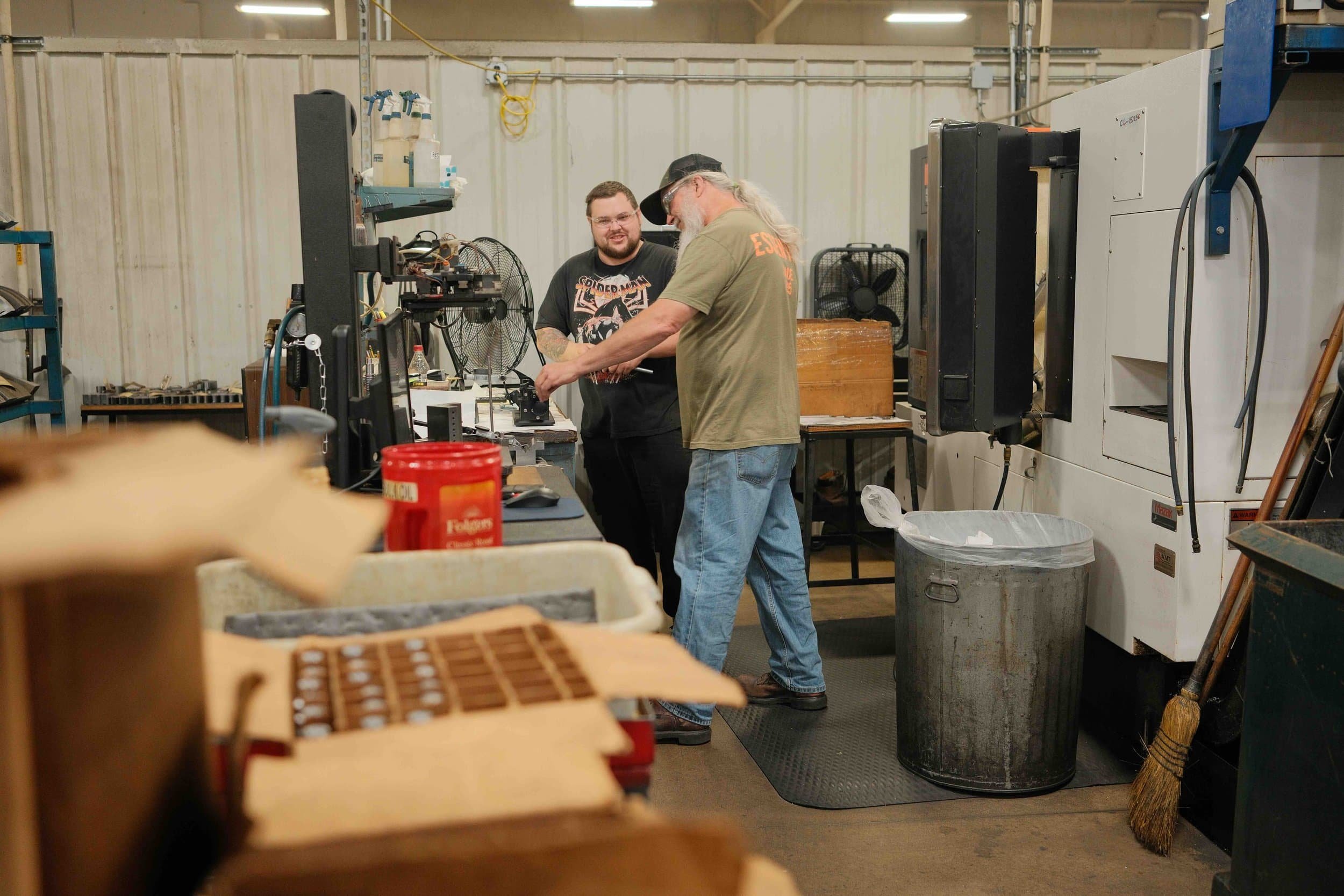 Clark Manufacturing machinists working together on the shop floor