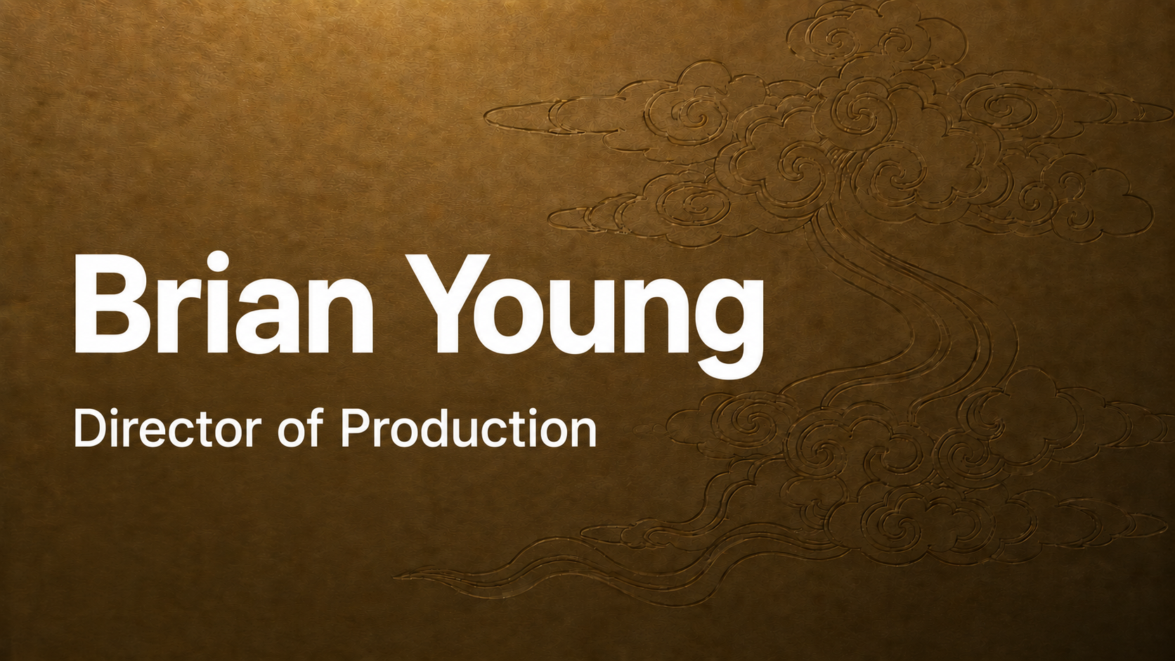 Business card with a gold textured background and an embossed cloud and wind design. Text reads 'Brian Young, Director of Production'.