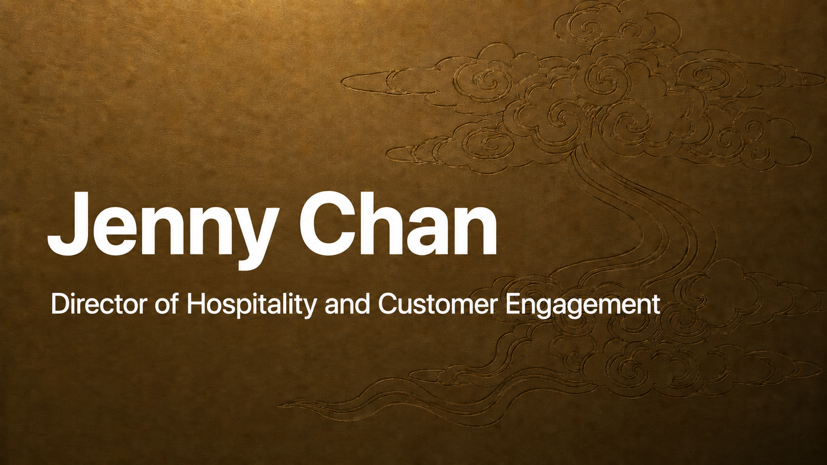 Name and title card for Jenny Chan, Director of Hospitality and Customer Engagement, with a gold textured background and an engraved cloud and wind design.