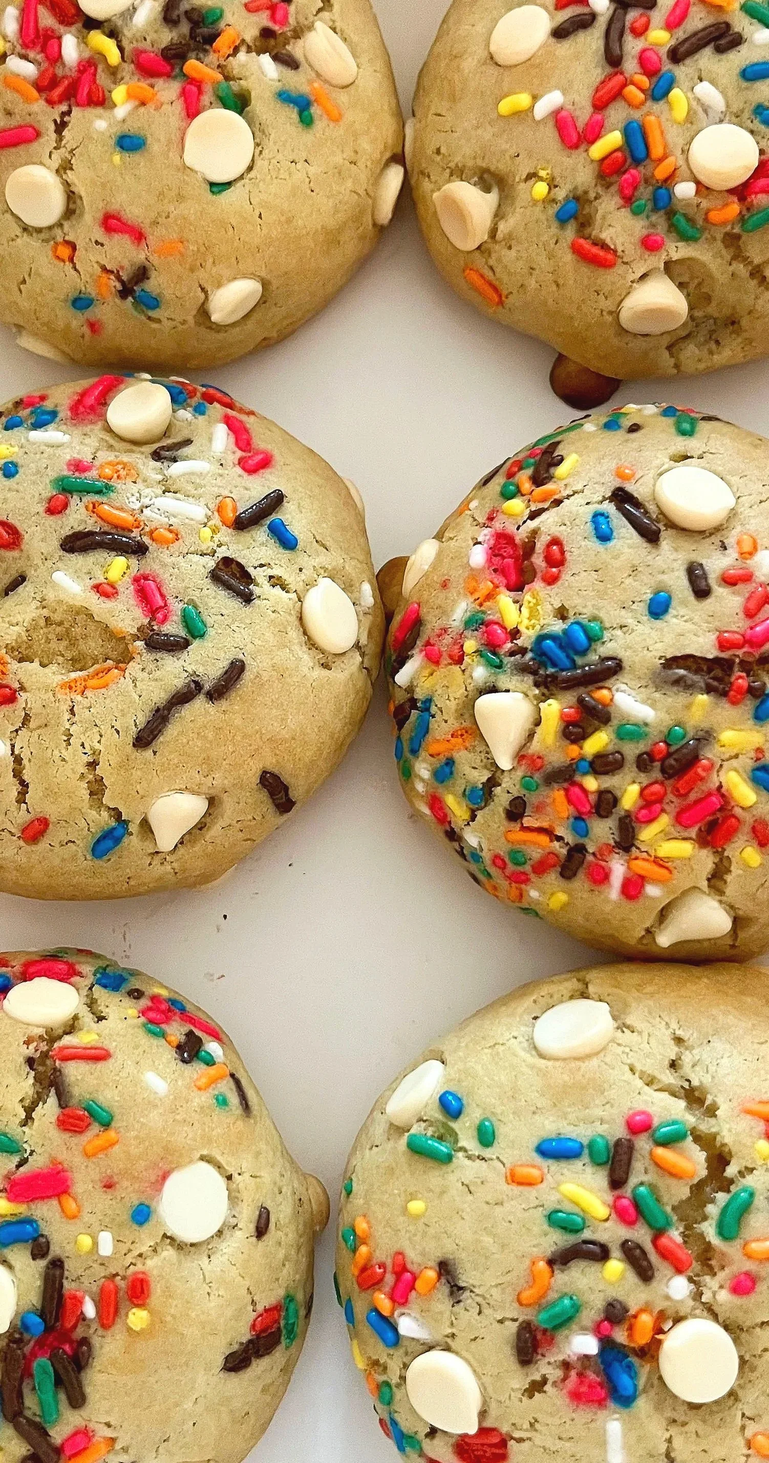 Birthday Cake Cookie
--
A buttery vanilla cookie packed with colorful rainbow sprinkles and creamy white chocolate chips, finished with a sweet birthday cake flavor that tastes like every celebration in one bite.
