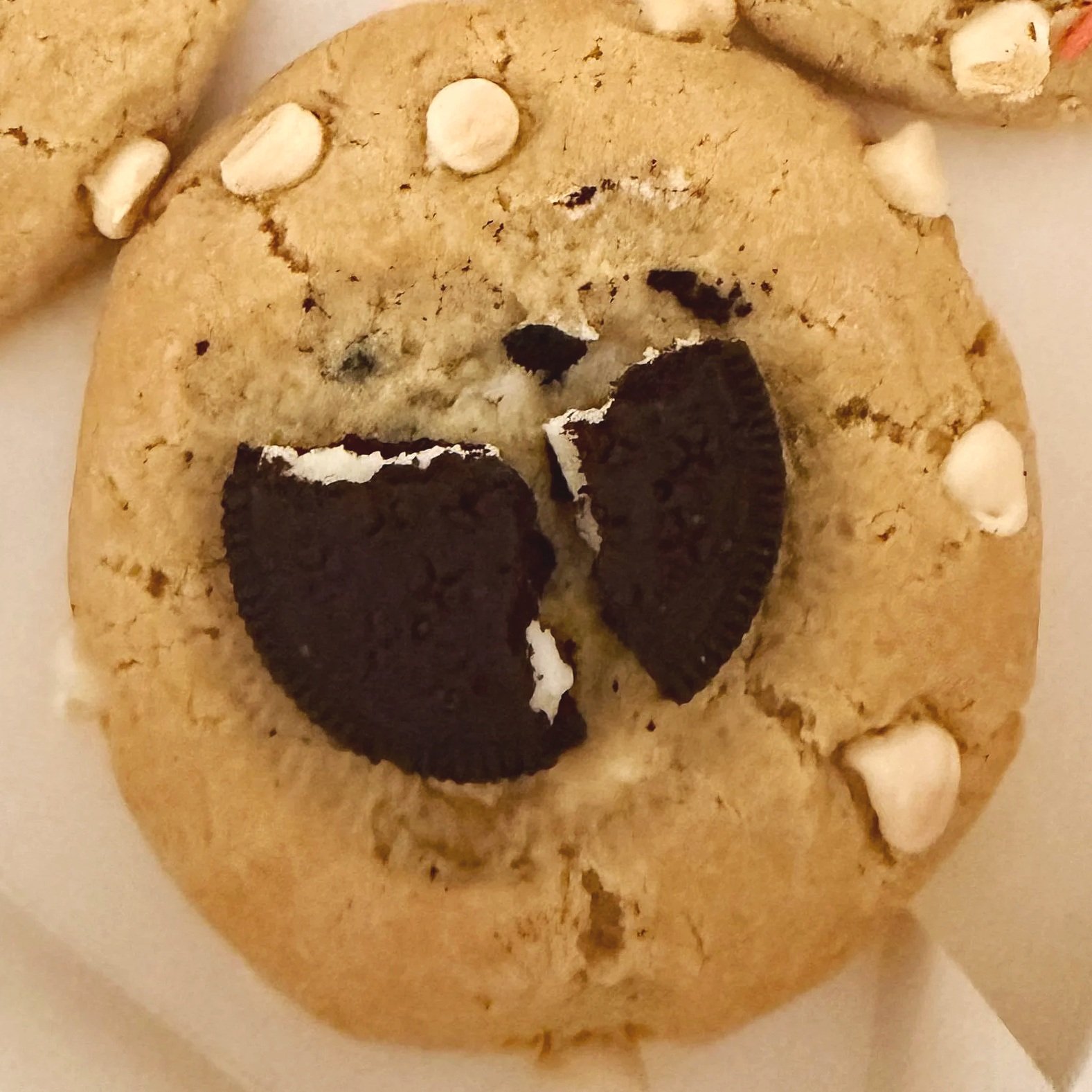 Cookies & Cream Cookie -- A soft vanilla cookie packed with chunks of chocolate sandwich cookies, stuffed with a luscious cookies-and-cream filling, and finished with creamy white chocolate. Every bite is rich, velvety, and loaded with cookies-and-cr