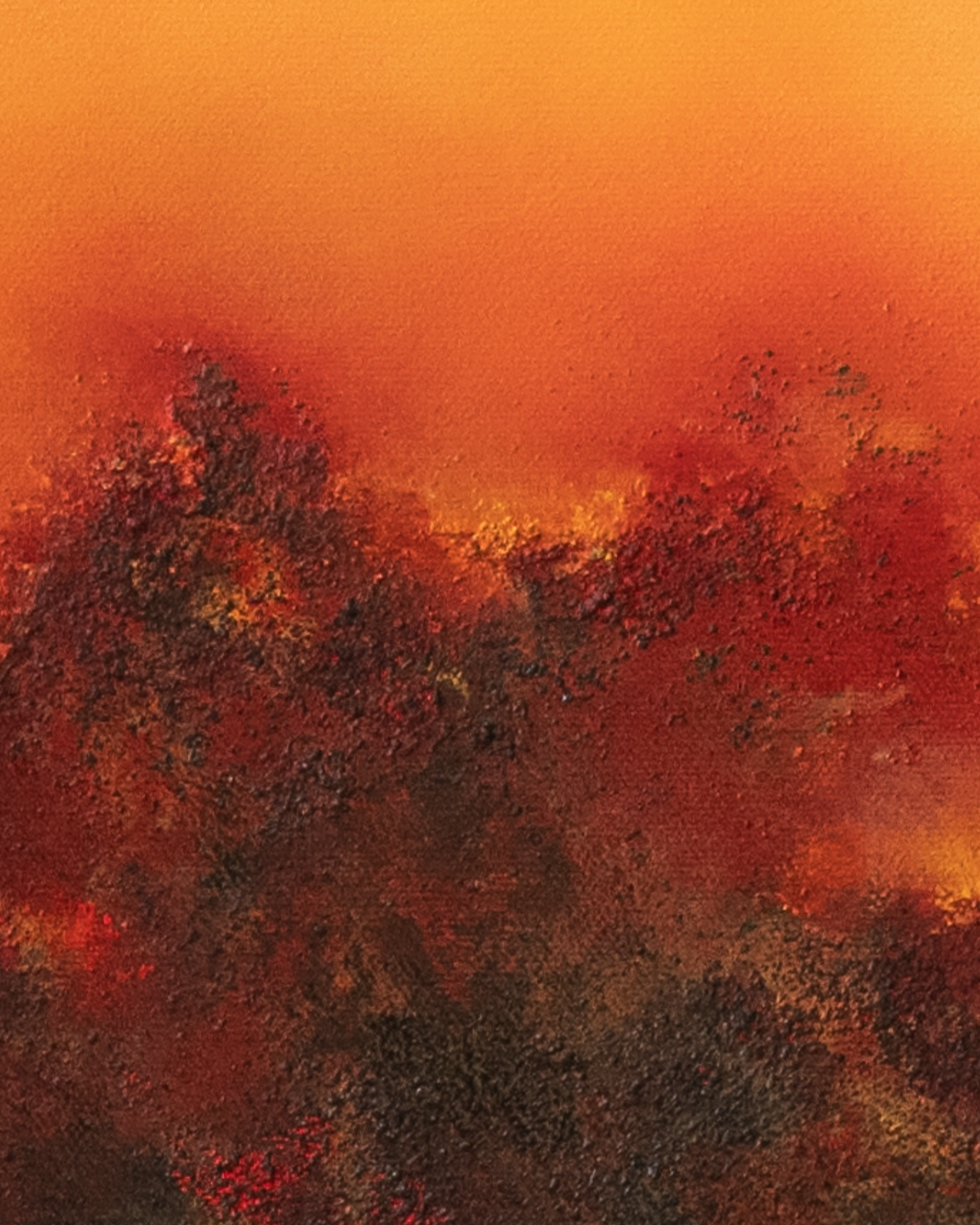 Close-up detail of Unbound, showing volcanic texture, deep dark pigments and vivid passages of orange, red and yellow light.