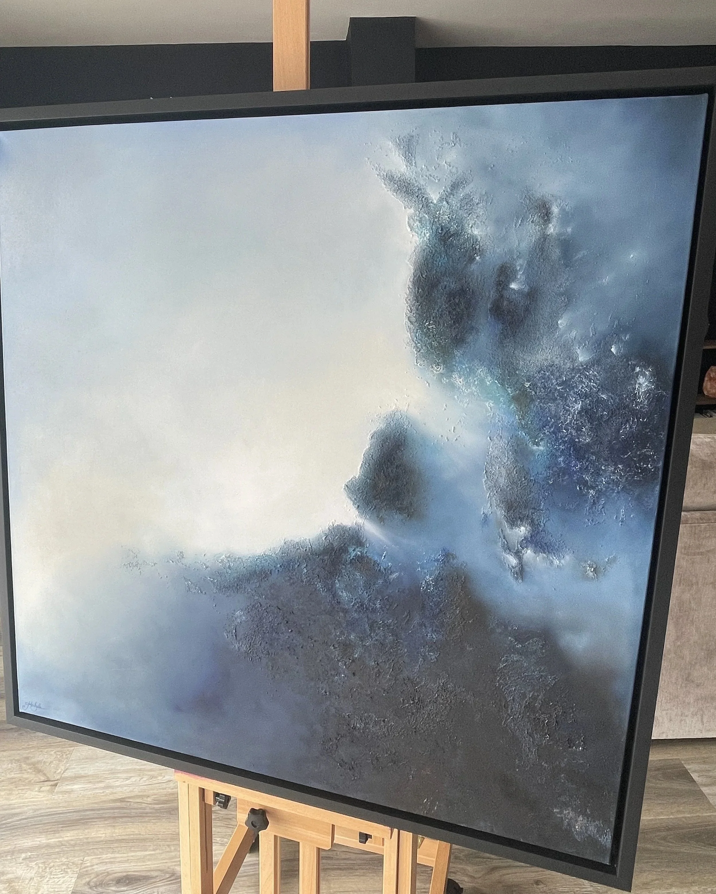 Sanctuary, atmospheric abstract oil painting by Mechelle Tebbs, featuring sweeping blue forms rising through a softly illuminated background.