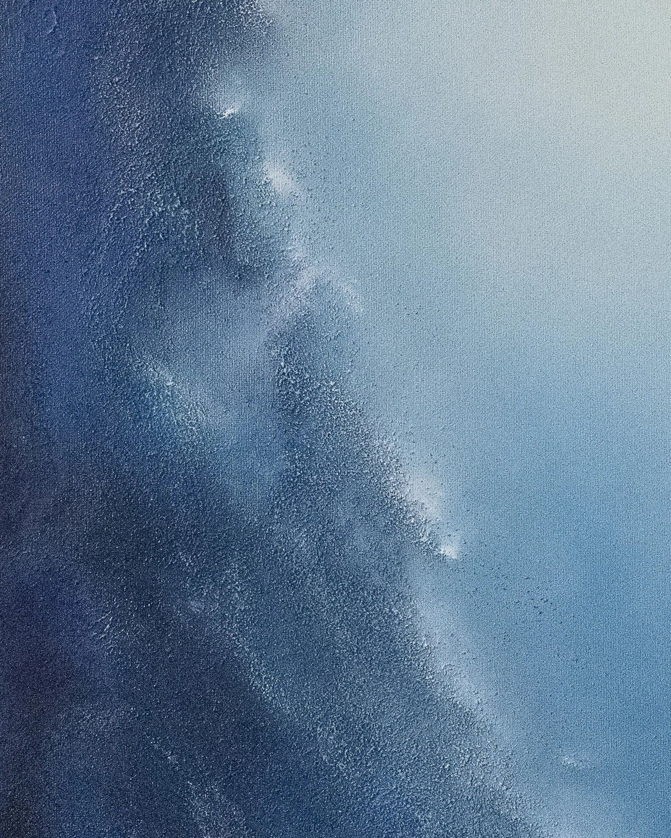 Close-up detail of Emergence, showing richly layered blue texture surrounding a radiant circular light.