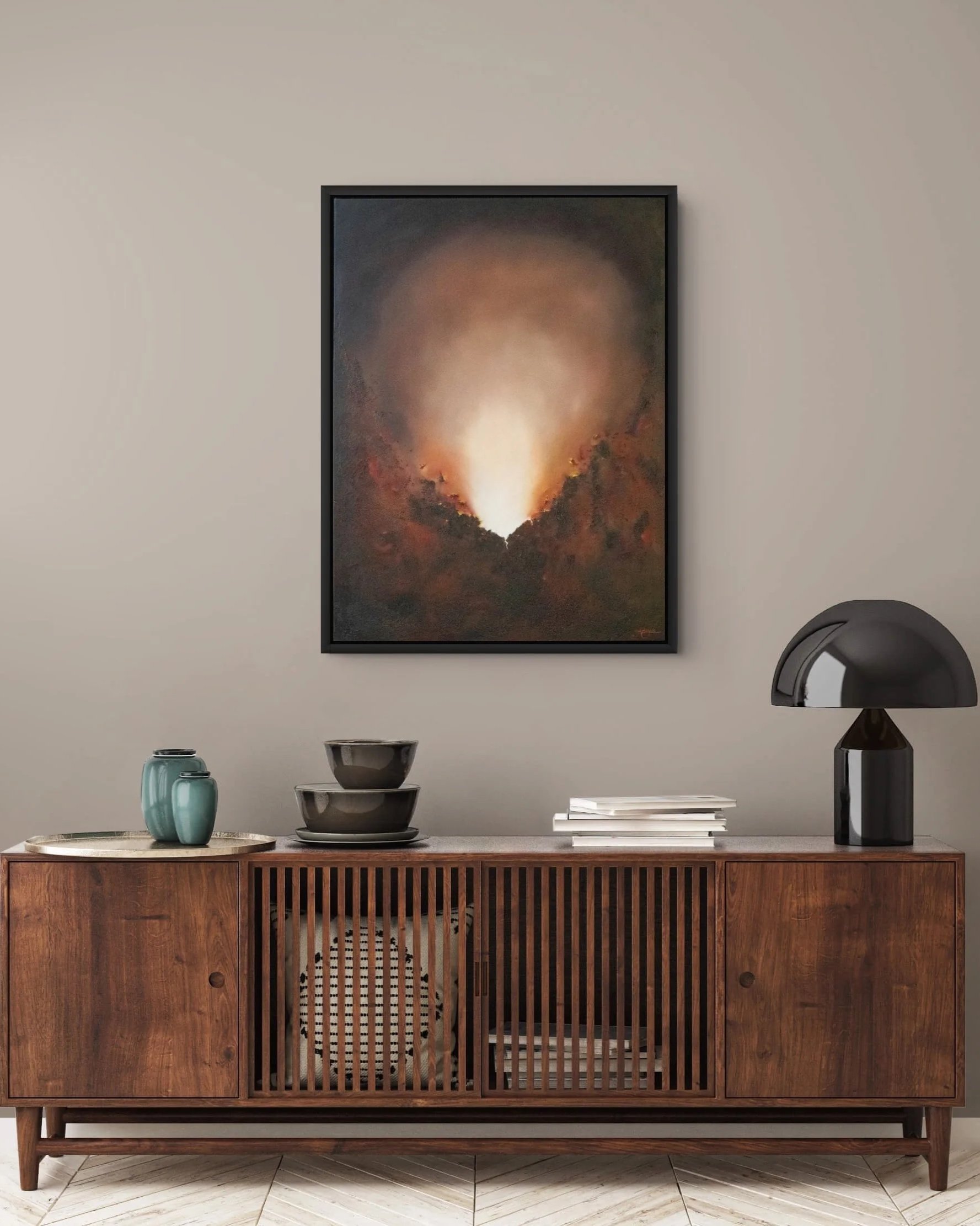 Unextinguished by Mechelle Tebbs displayed above a fireplace in a dark contemporary interior.