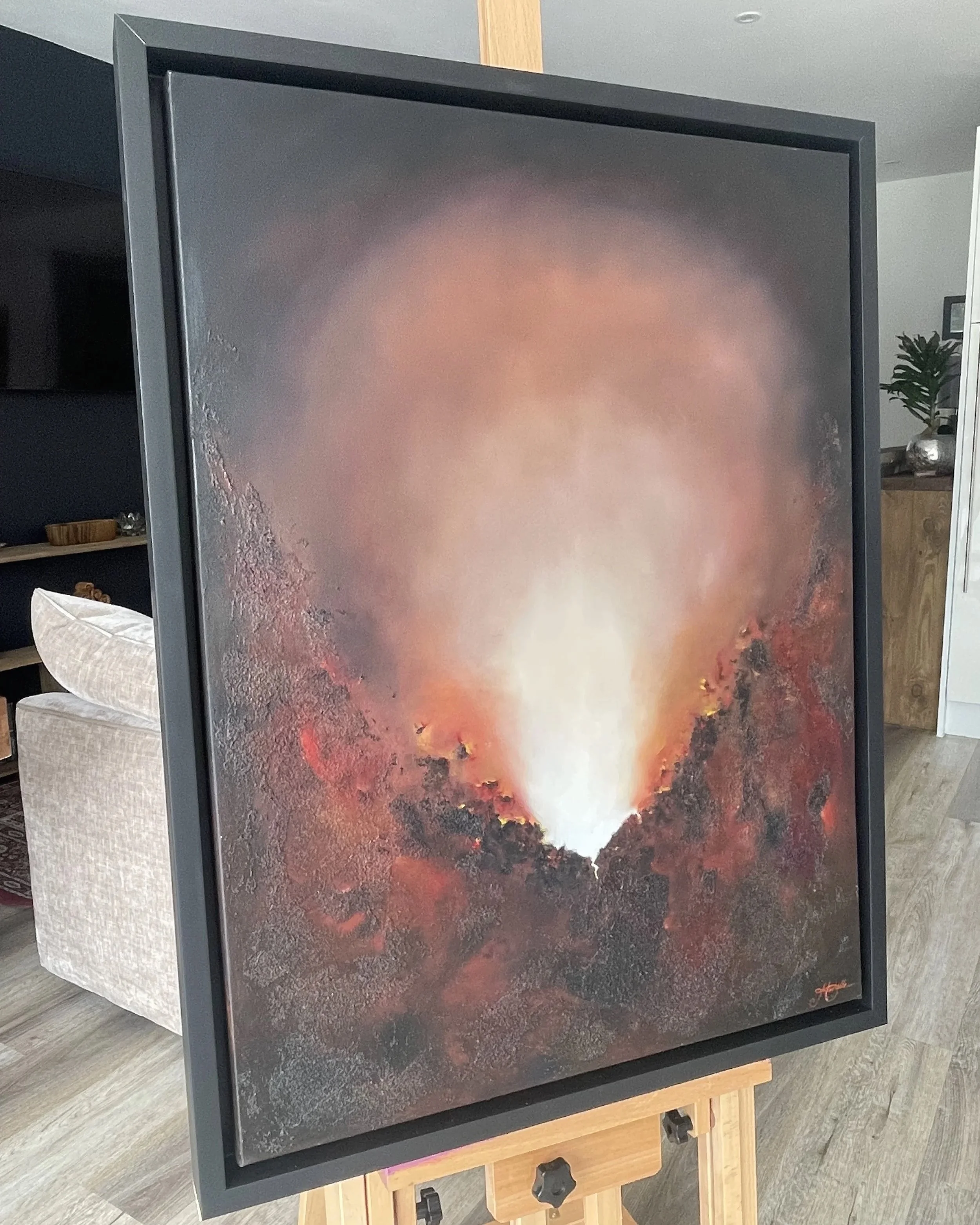 Unextinguished, atmospheric abstract oil painting by Mechelle Tebbs, featuring a brilliant rising light surrounded by richly textured rust, brown and charcoal tones.
