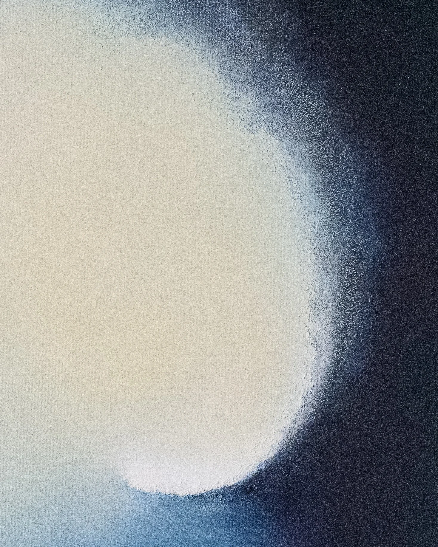 Close-up detail of Emergence, showing richly layered blue texture surrounding a radiant circular light.