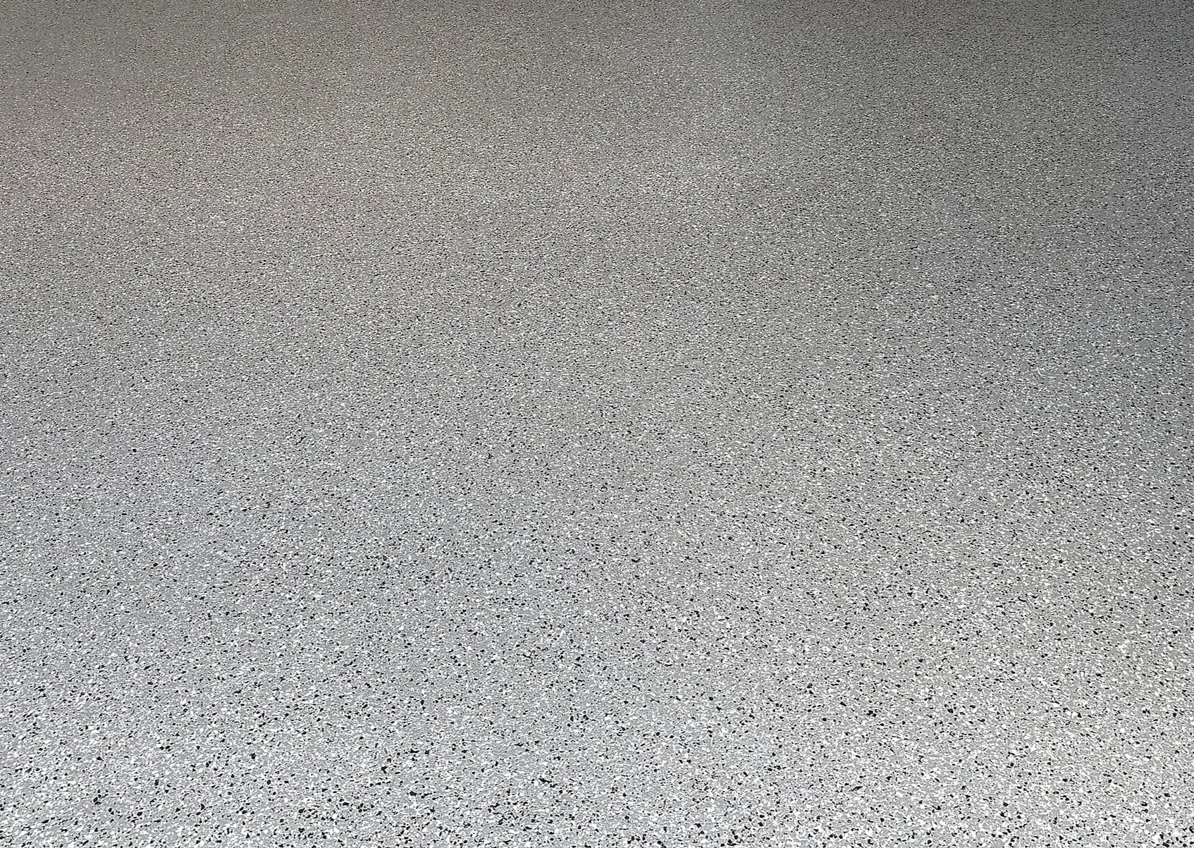 A textured gray surface resembling a speckled asphalt or concrete pavement.