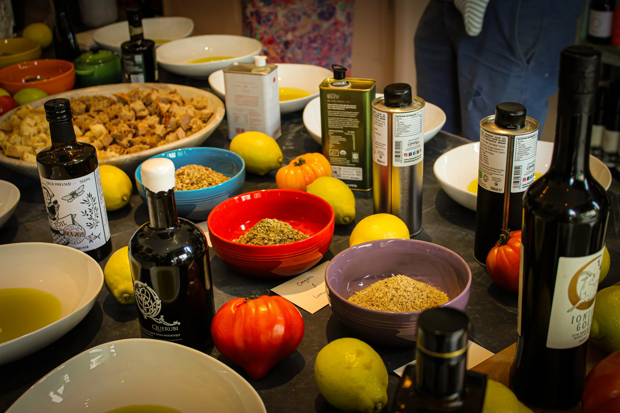 Seasonal Mediterranean ingredients, herbs and extra virgin olive oil prepared for a Monsieur Bou catering event.