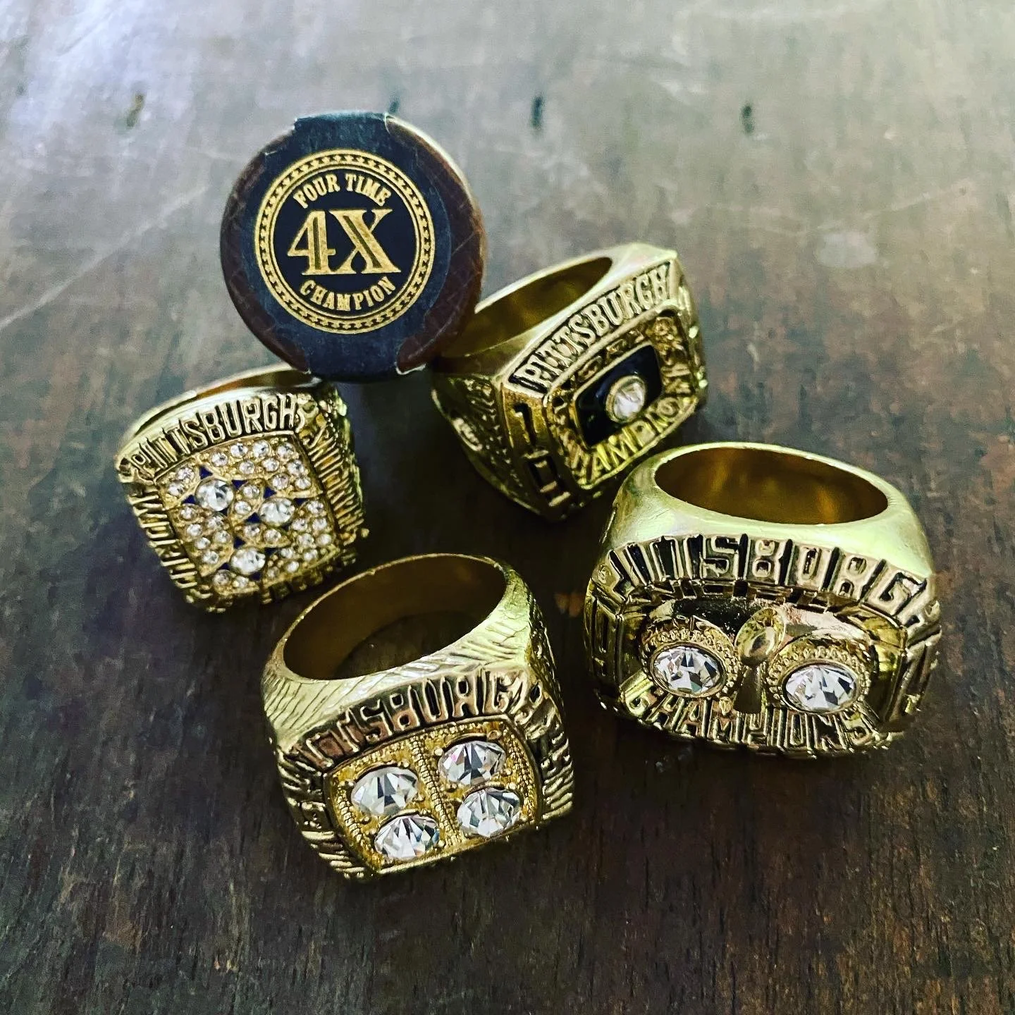 stack of superbowl championship rings