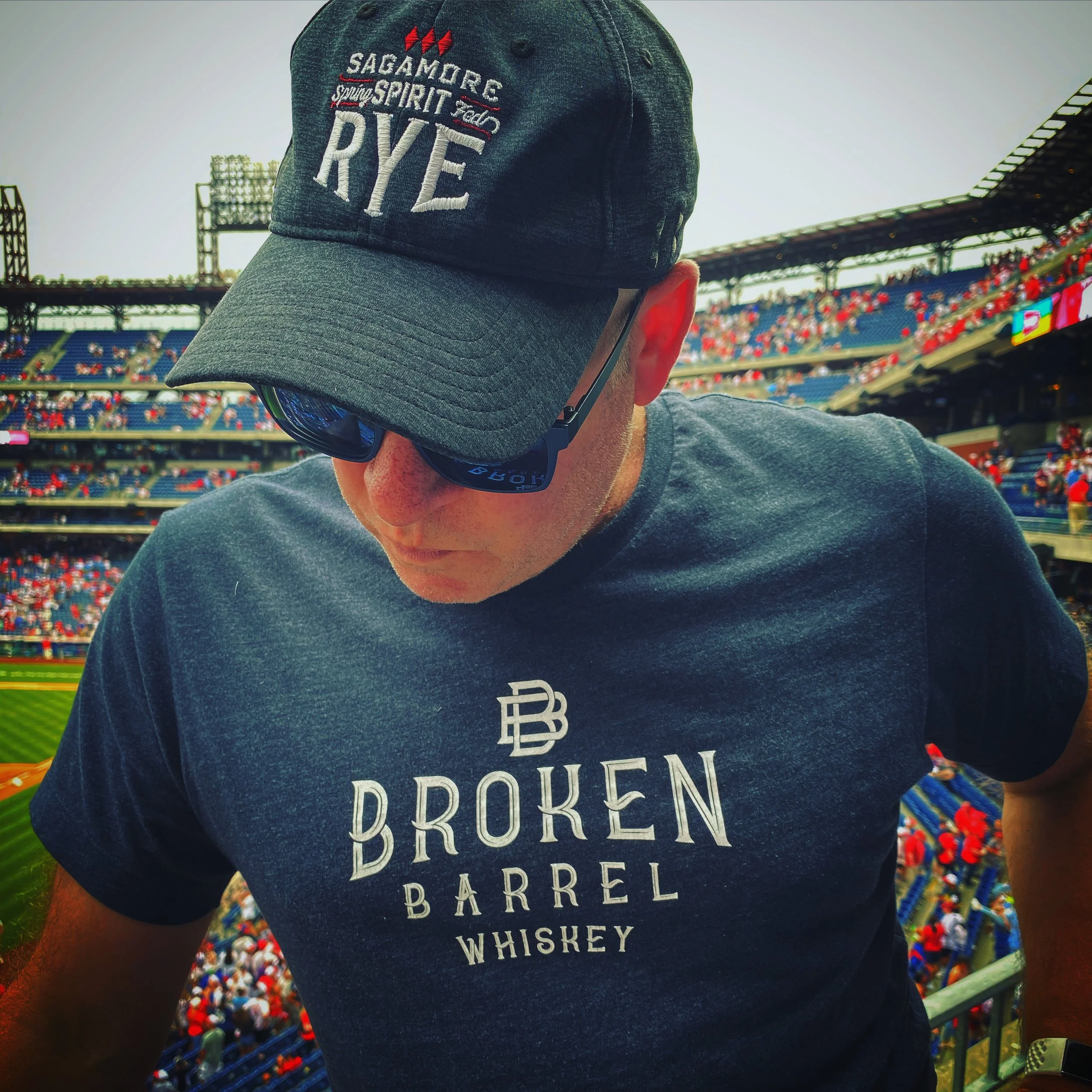 Mark Makers, founder of Whiskey Links®& More, at a phillies game wearing whiskey apparel