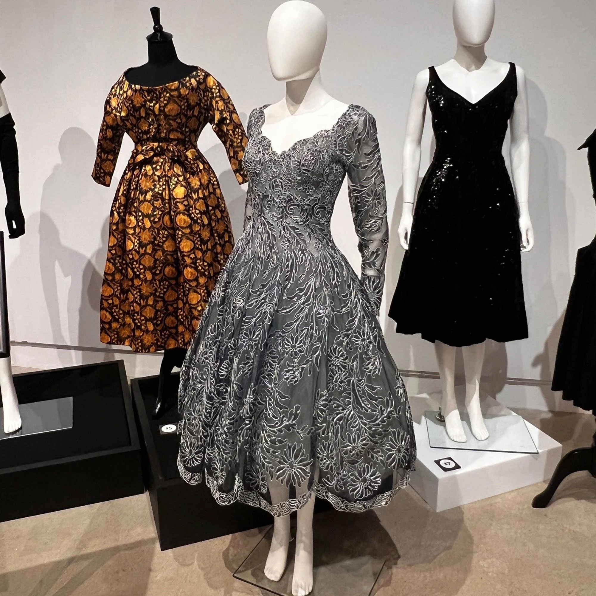 Silver embroidered gown with floral and black gowns from the Made in France: French Fashion exhibition.