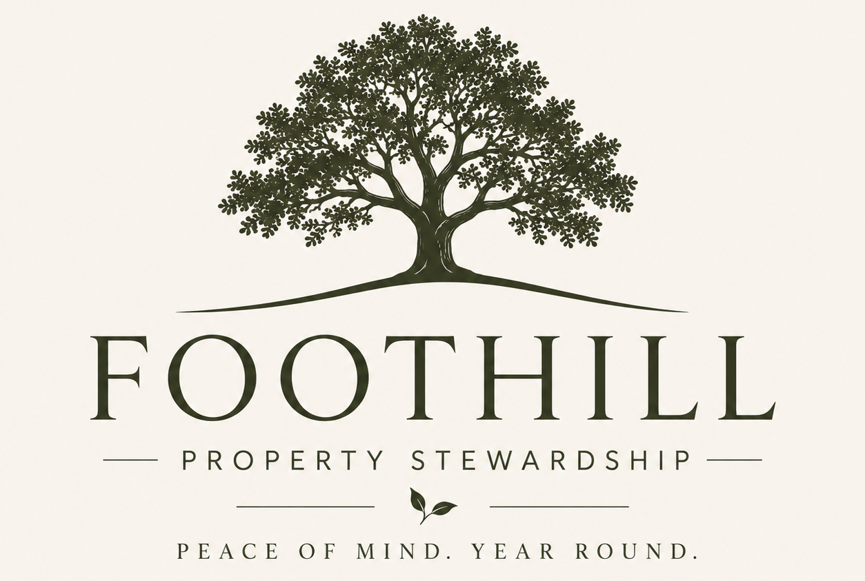 Logo for Foothill Property Stewardship featuring a large green tree above the company name and tagline, with a small leaf icon and the phrase 'Peace of Mind. Year Round'.