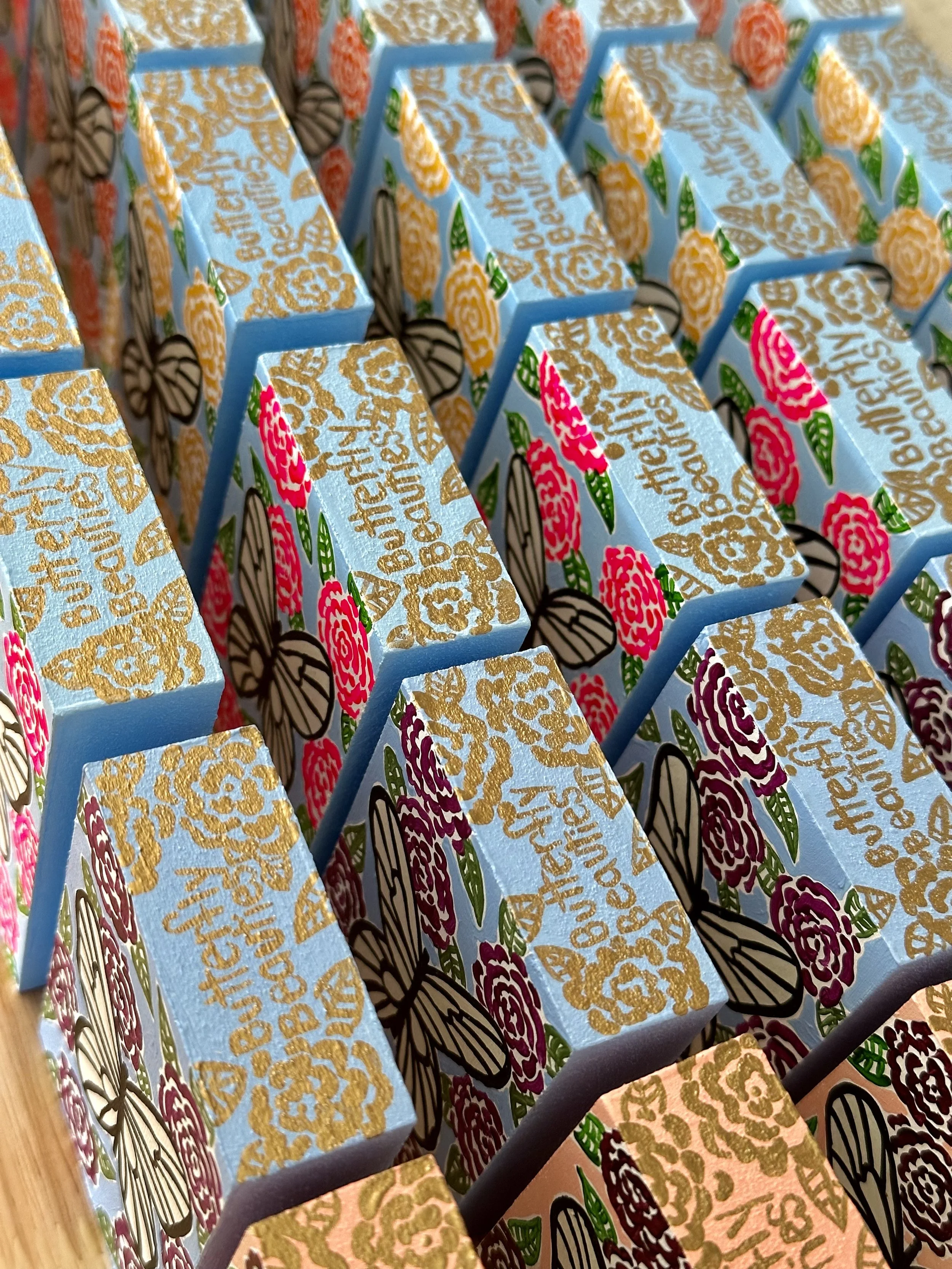 Gold edge name details on the butterfly beauties collection.