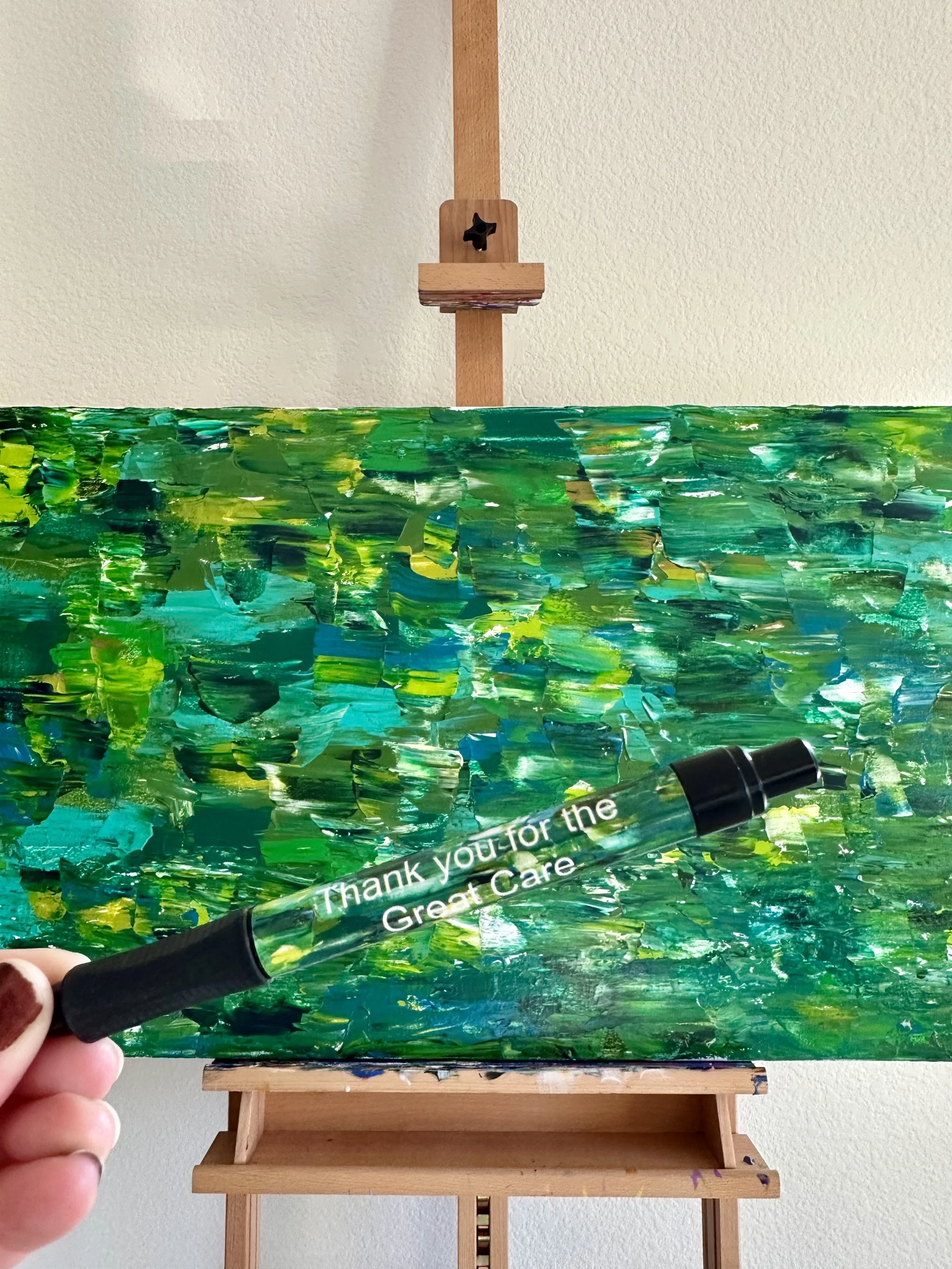 Variety of green colors in an abstract painting.