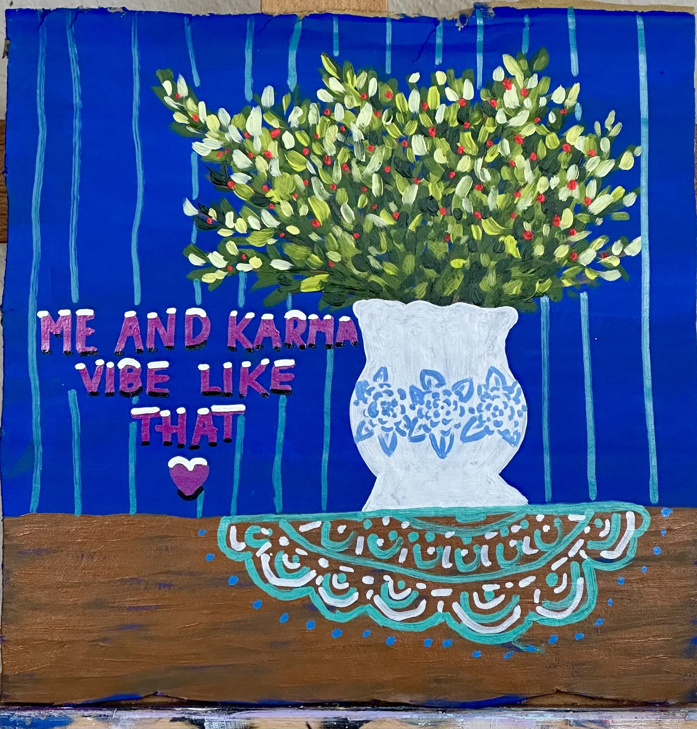 Still life with doily and Taylor Swift lyric painting.