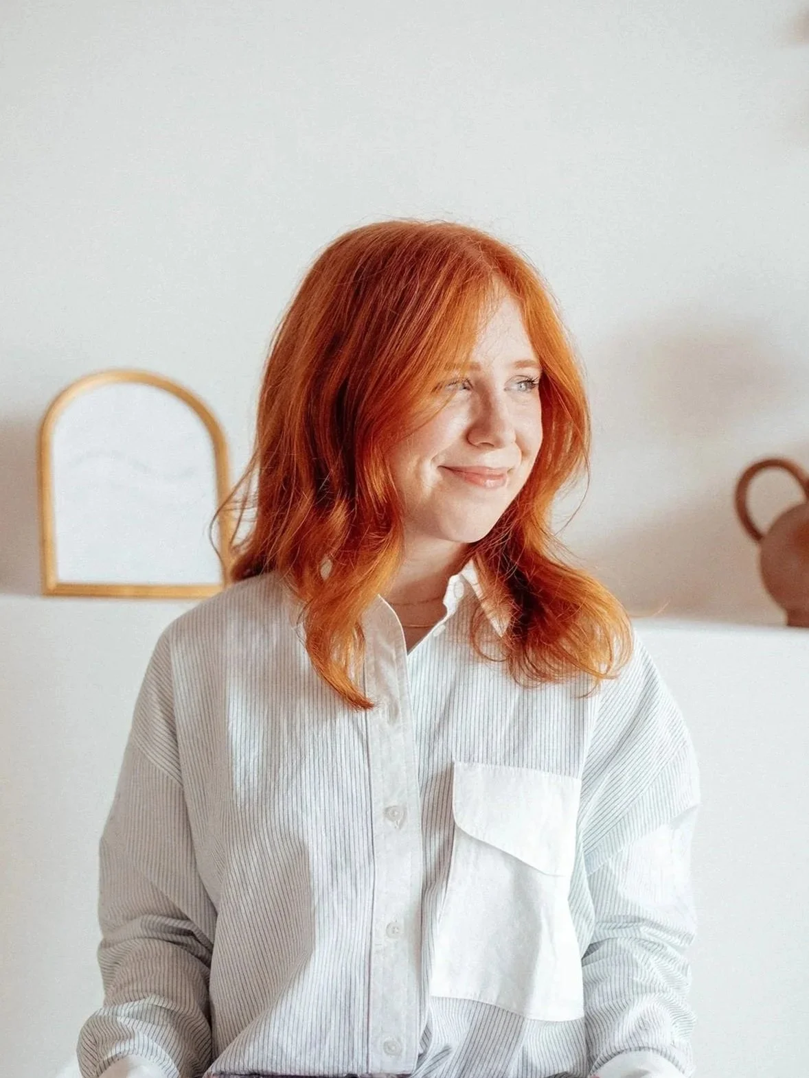 Haleigh Culverhouse, certified Enneagram coach, smiling in a relaxed portrait.