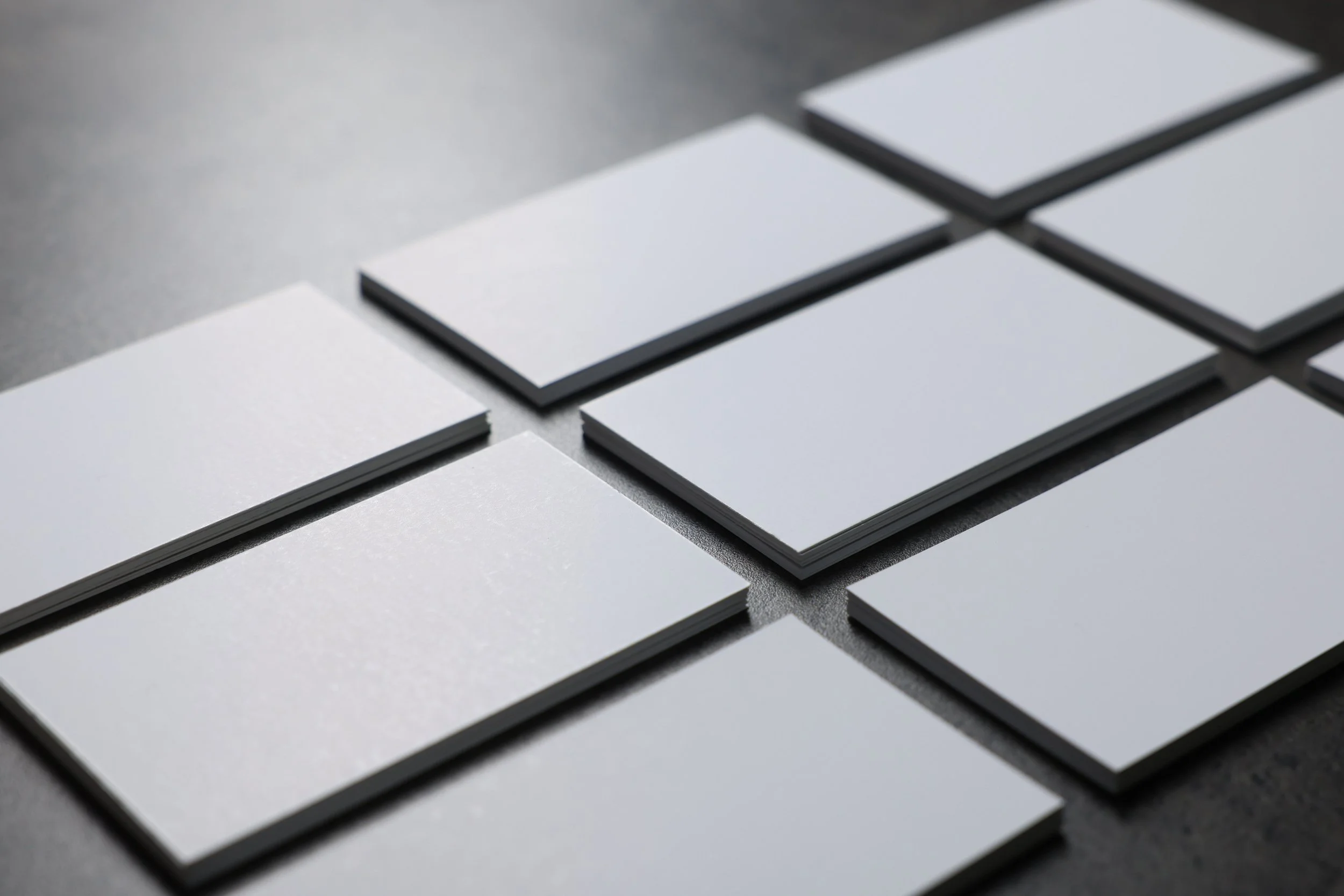 grid-of-blank-white-business-card-stacks-on-textur-2026-05-18-19-29-48-utc.jpg