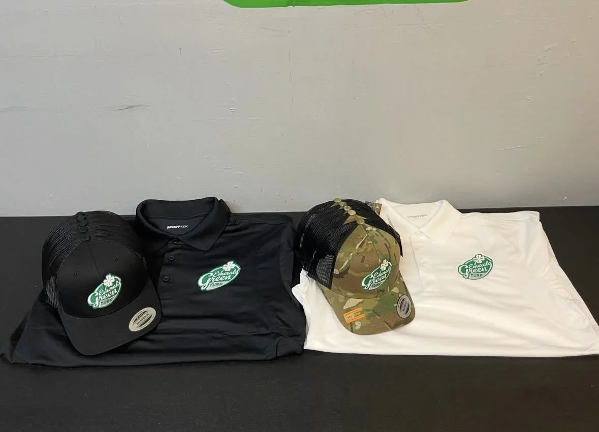 Landscaping company shirts and hats that have been embroidered.